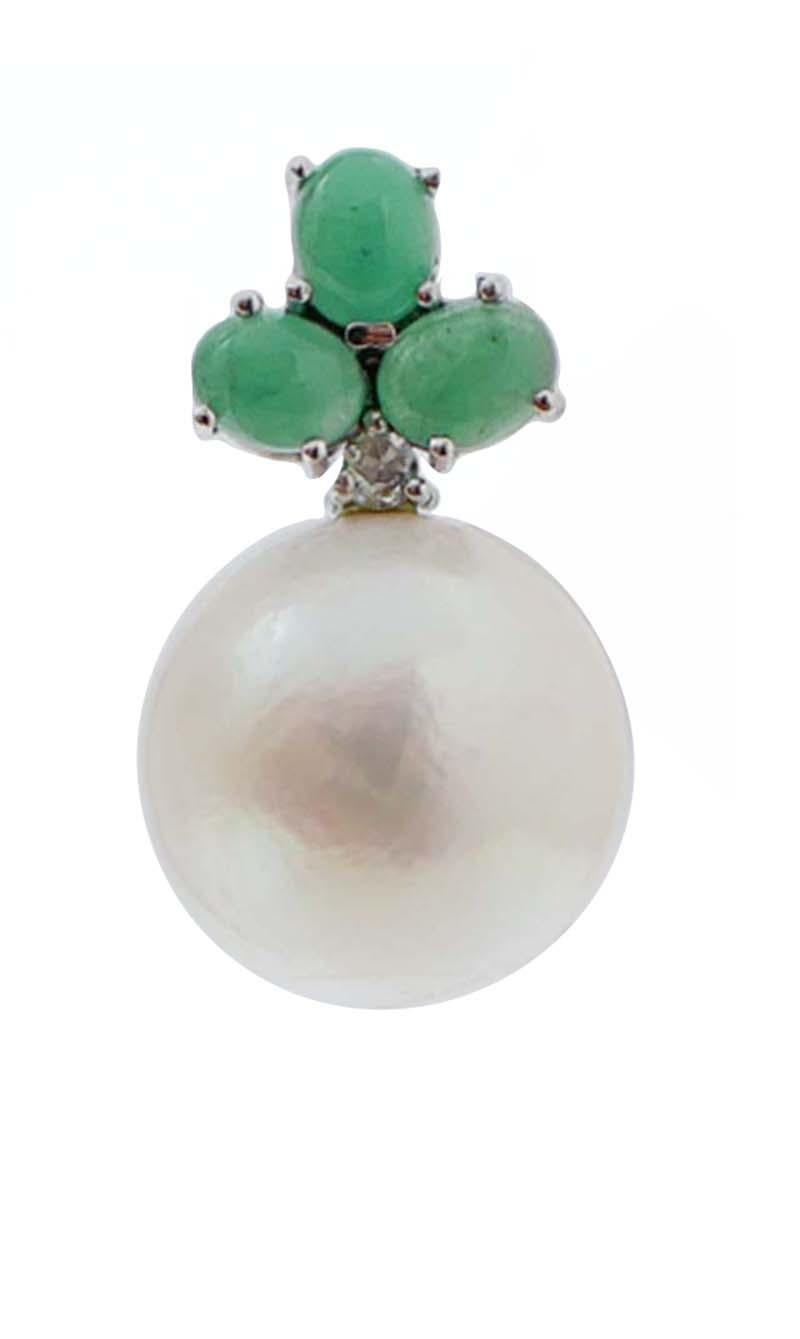 Beautiful earrings in 14 karat white gold structure mounted with oval emeralds in the upper part; below, a diamond and a white pearl.
Diamonds 0.13 ct
Sapphires 2.43 ct
Pearls 7.40
Total Weight 10.20 gr
RF +GFGA

For any information, feel free to