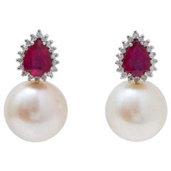 14 Mm Pearls, Rubies, Diamonds, 18 Karat White Gold Earrings.