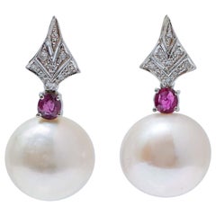 14 Mm White Pearls, Rubies, Diamonds, Platinum Earrings.