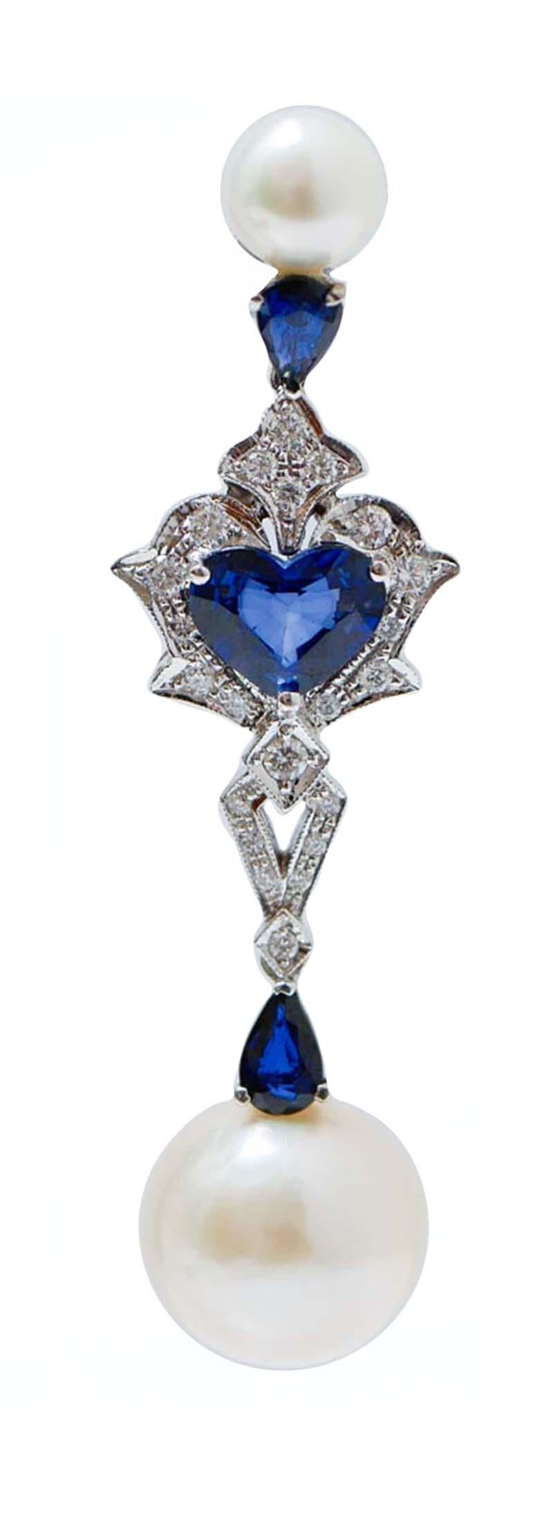 Beautiful earrings in 14 kt white gold structure mounted with a pearls and a drop sapphire in the upper part; in the middle, an heart sapphires surrounded by diamonds and, in the final part, a drop sapphire with a pearl of 14 mm.
These earrings were