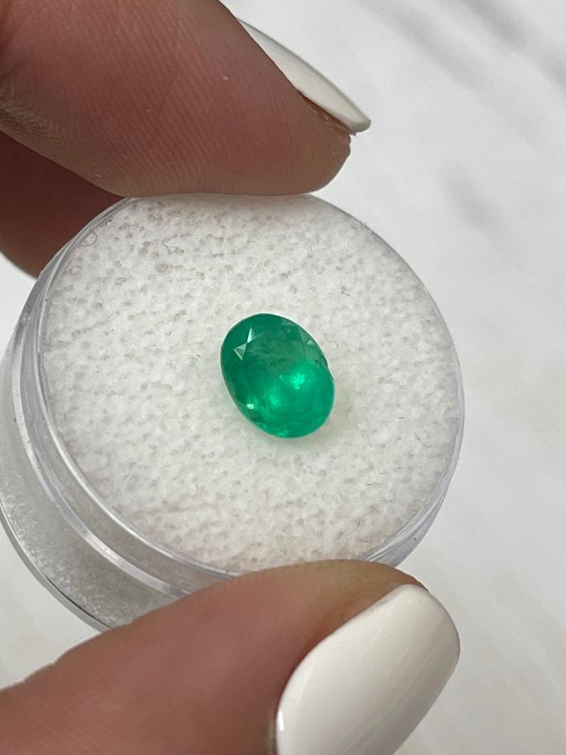 Modern 1.40 Carat Apple Green Colombian Emerald - Oval Cut May Birthstone Gem For Sale