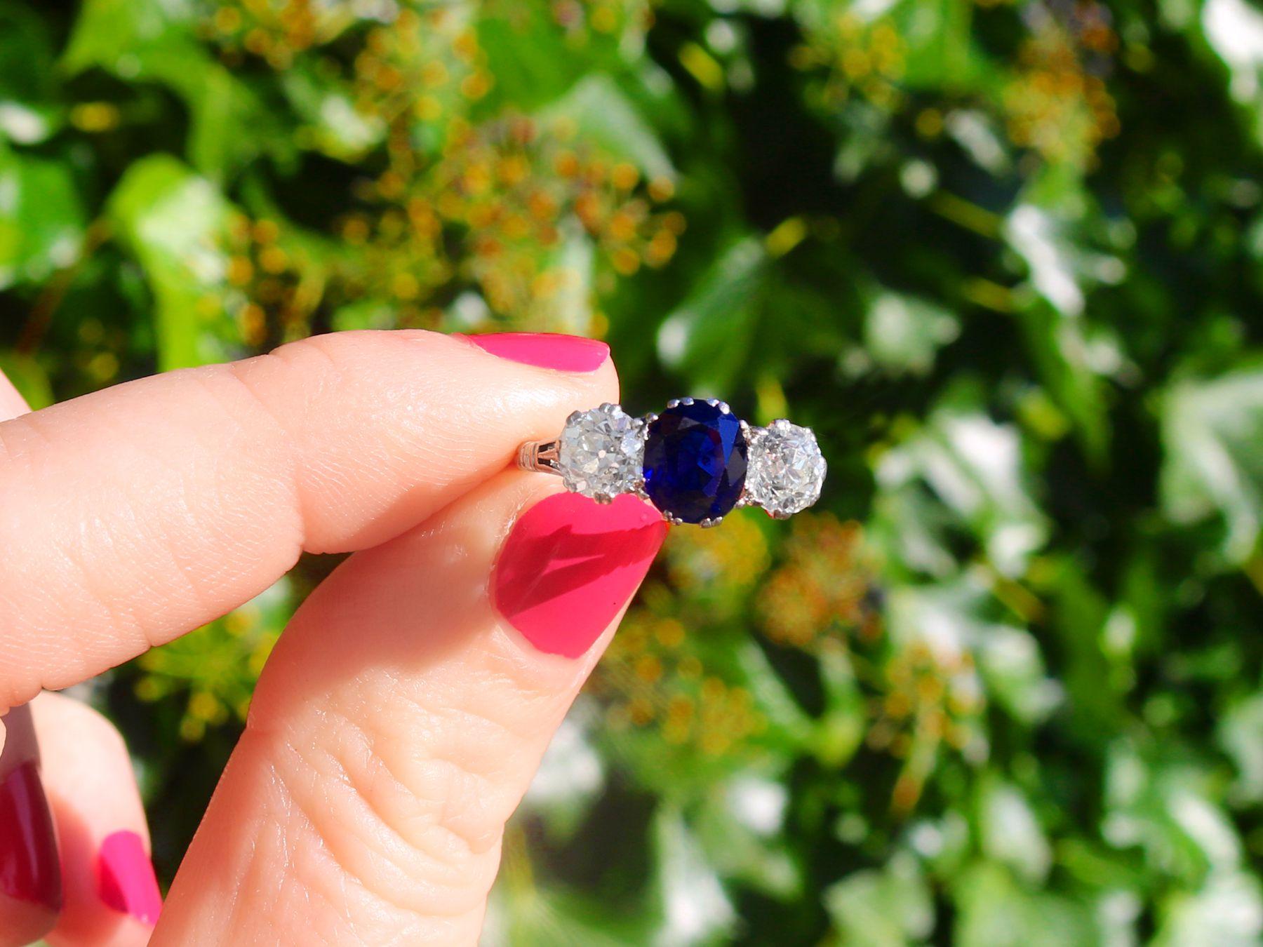 A stunning, fine and impressive vintage 1.40 carat Burmese sapphire and 1.38 carat diamond, palladium trilogy ring; part of our diverse sapphire jewelry and estate jewelry collections.

This stunning, fine and impressive sapphire ring has been