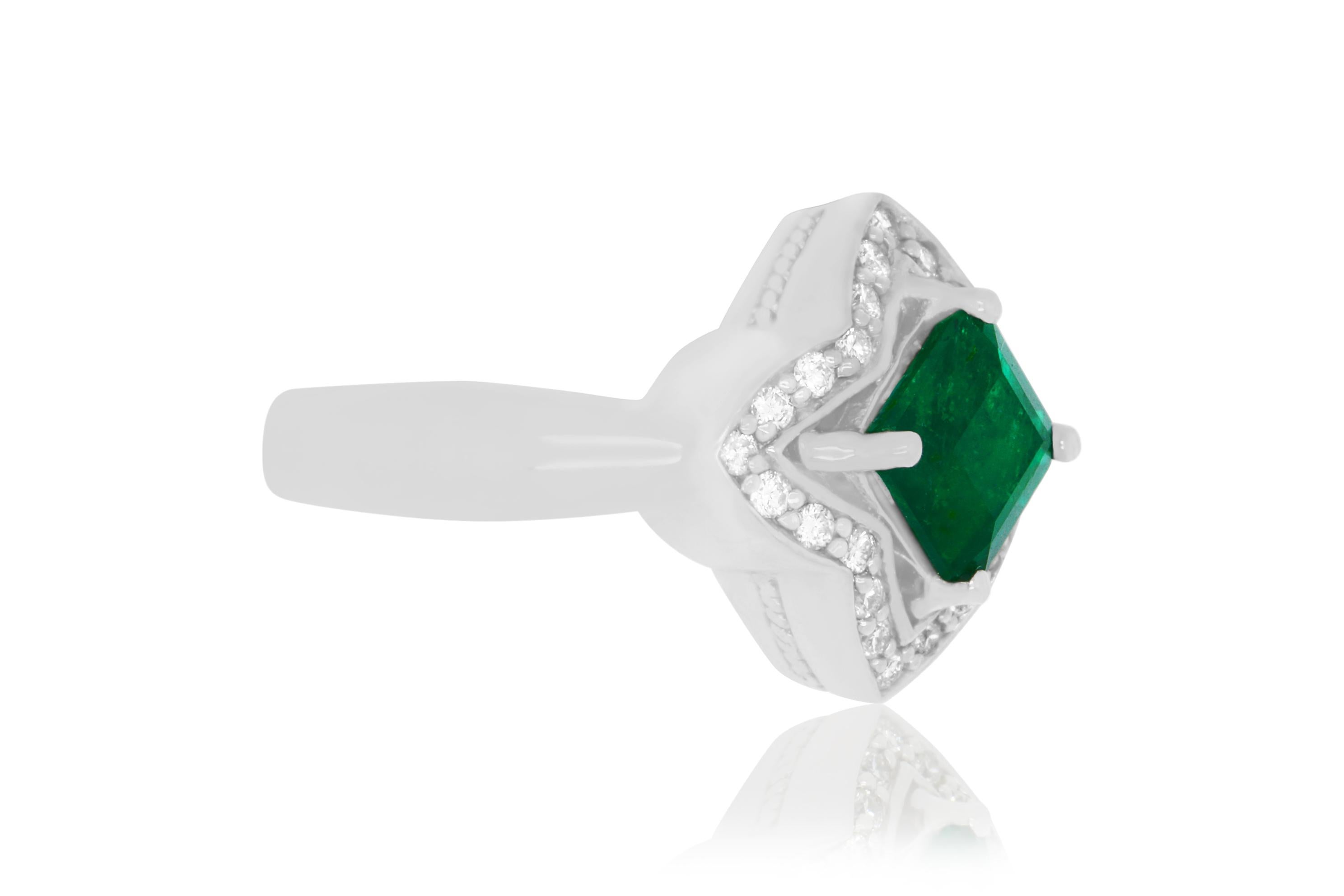 A stunning Cushion Cut Emerald encased in 14K white gold and 0.29 Carats of Brilliant Round White Diamonds. A stunning, classic look for all occasions!

Material: 14k White Gold 
Center Stone Details: 1 Cushion Cut Emerald at 1.40 Carats 
Mounting