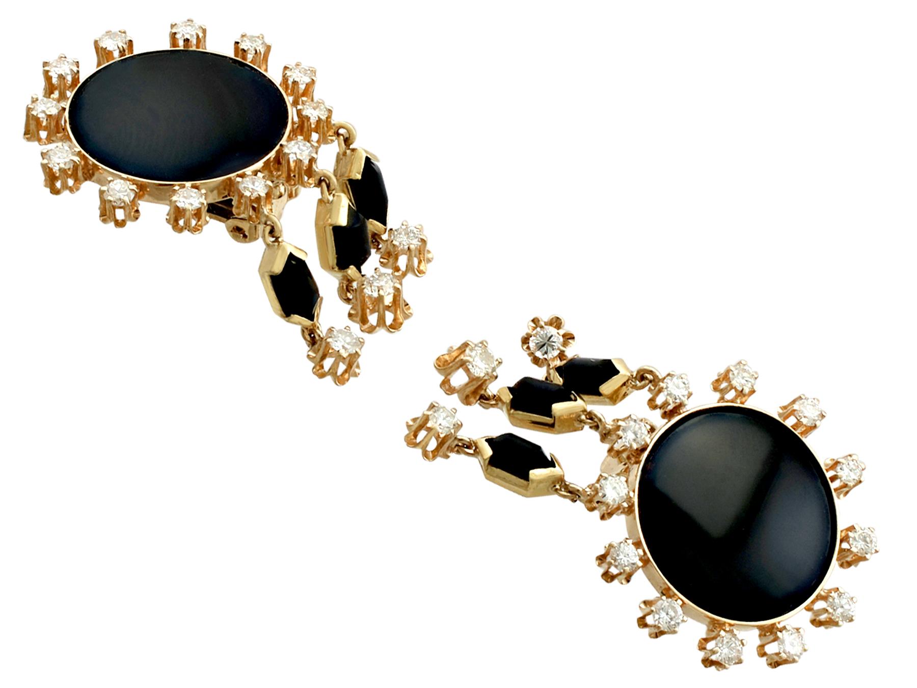 A stunning, fine and impressive pair of vintage black onyx and 1.40 carat diamond, 14 karat yellow gold Art Deco style drop earrings; part of our diverse vintage jewelry and estate jewelry collections

These stunning diamond and onyx earrings have