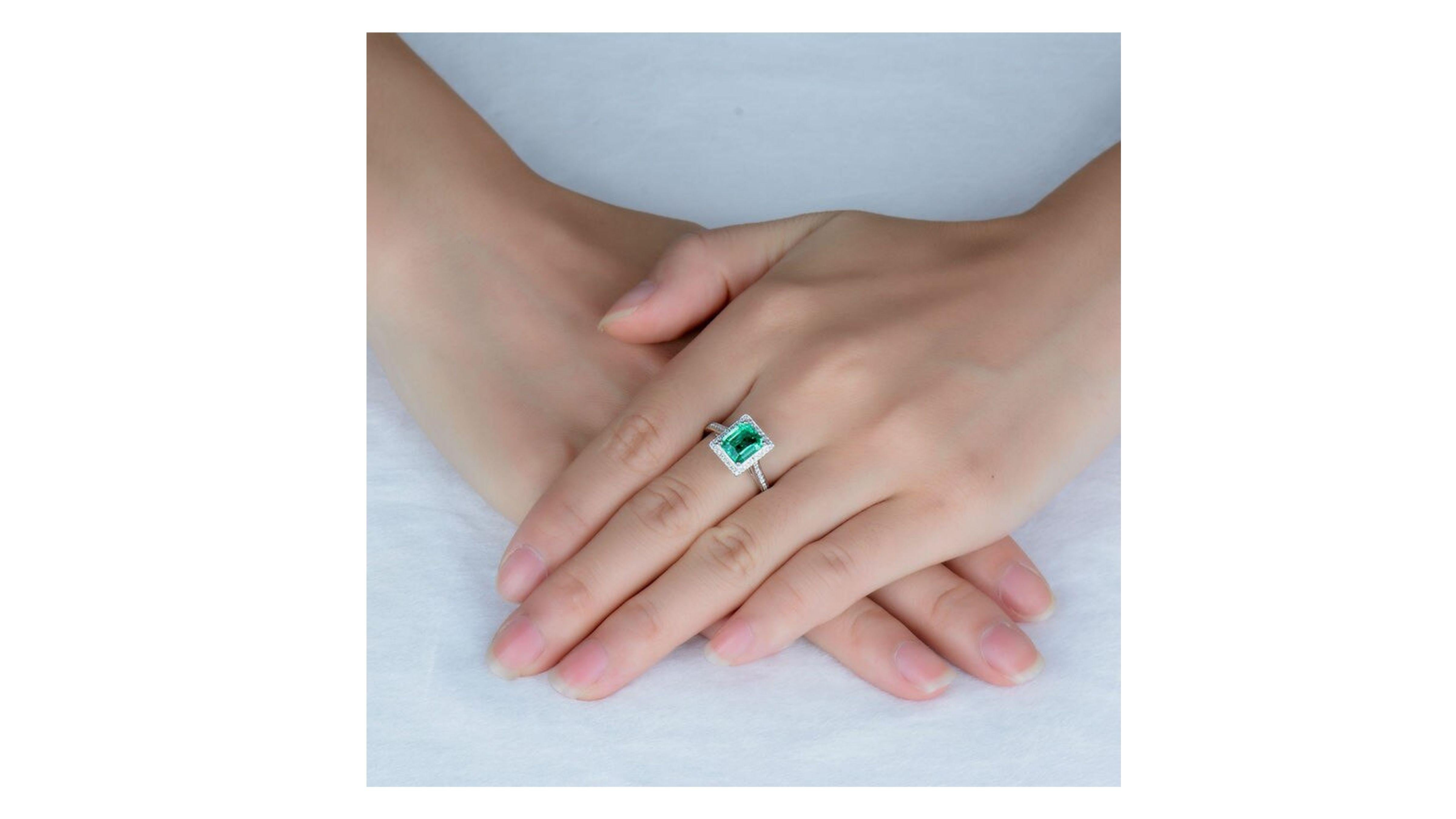 Women's 1.40 Carat Emerald Diamond Ring 14 Karat White Gold For Sale