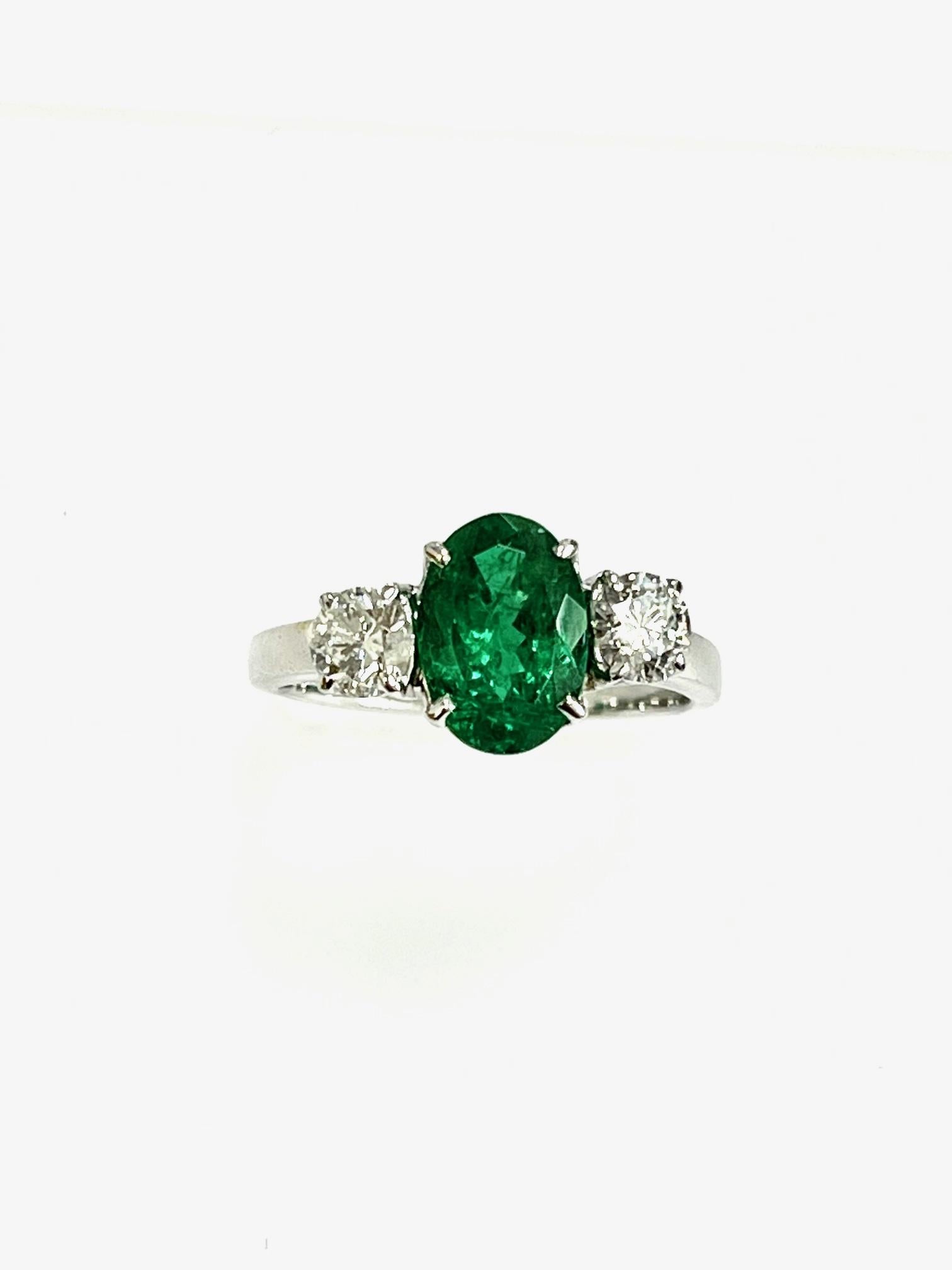 1.40 Carat Oval shape Zambian emerald set in 18k white ring with diamonds 