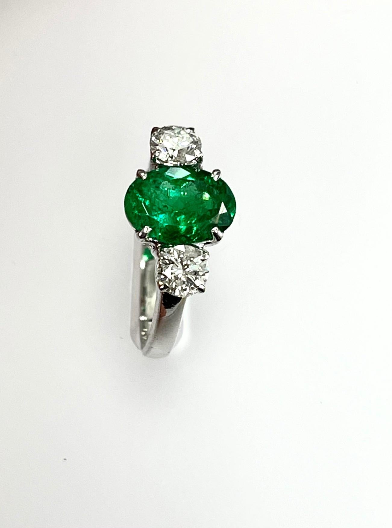 Modern 1.40 Carat Emerald Diamond Three-Stone Ring For Sale