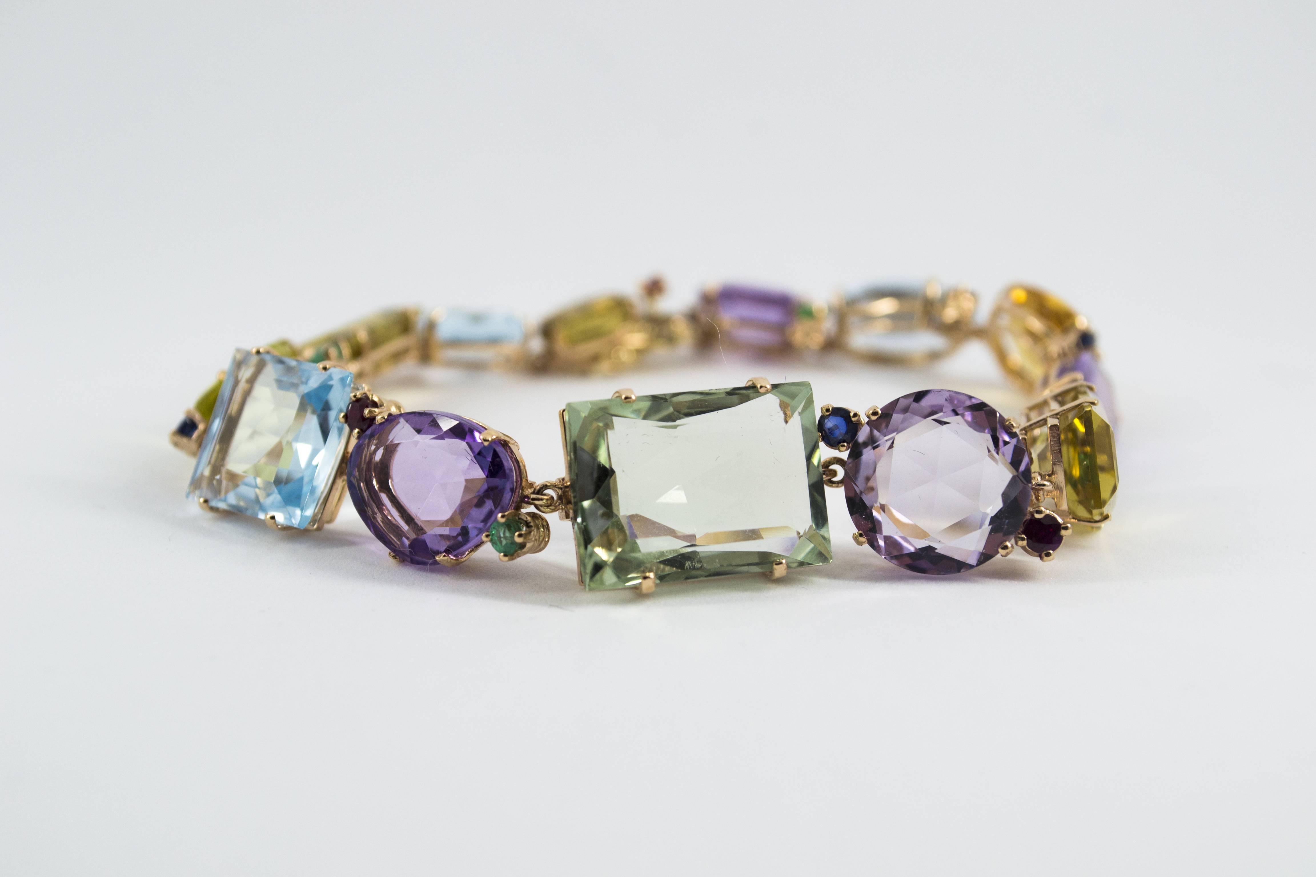 This Bracelet is made of 14K Yellow Gold.
This Bracelet has 1.40 Carats of Rubies, Sapphires and Emeralds.
This Bracelet has also Amethyst, Topaz, Quartz, Citrine.
We're a workshop so every piece is handmade, customizable and resizable.