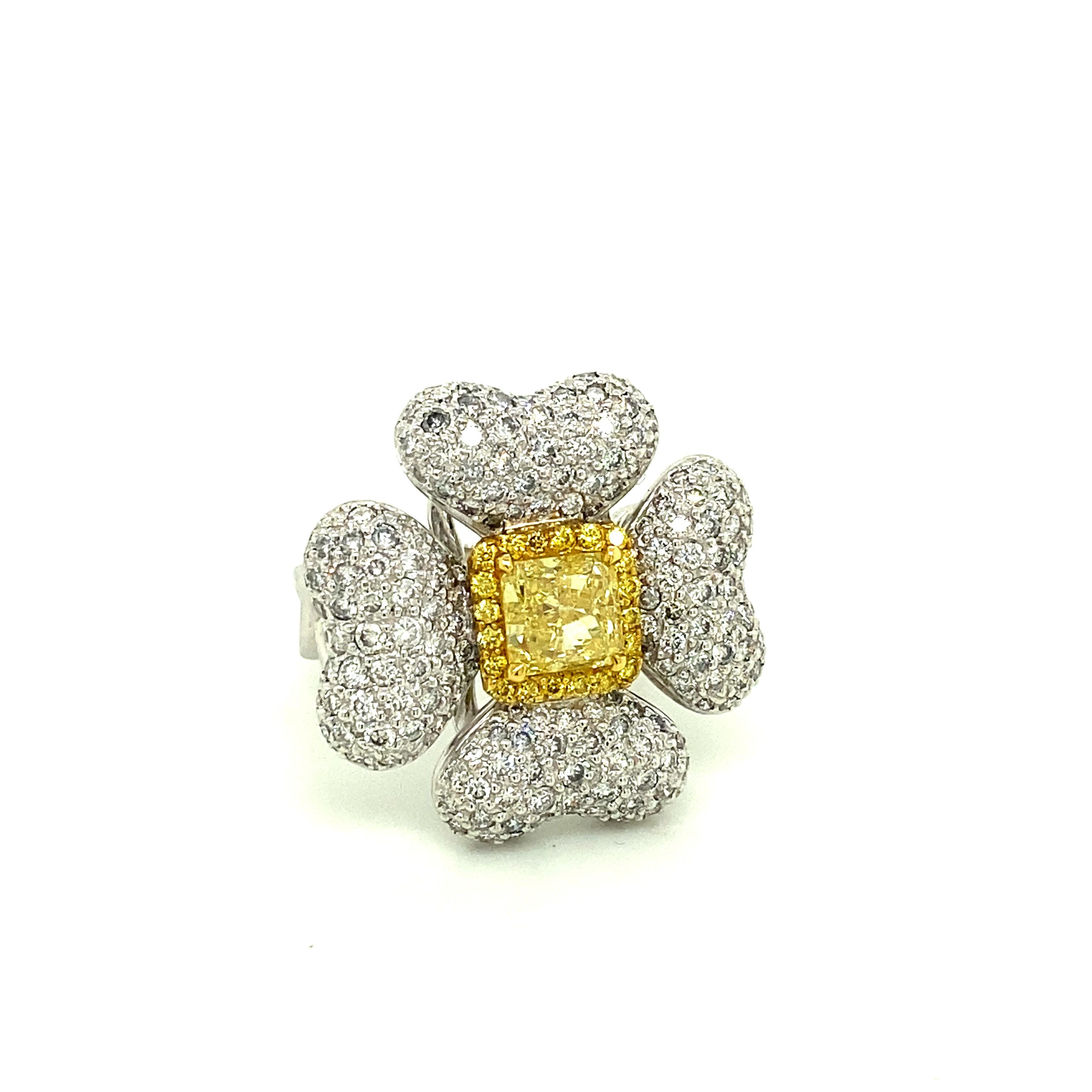 1.40 Carat GIA Certified Fancy Intense Yellow Diamond and Diamond Gold Ring:

A beautifully crafted ring, it features a 1.40 carat GIA certified fancy intense yellow diamond at the centre surrounded by a halo of yellow round brilliant diamonds, 