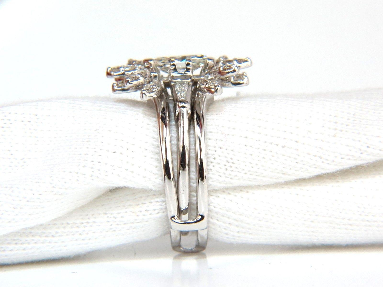 .60ct. Marquise diamond

Full cut brilliant

Obsolete sparkle and scintillation.

H-color

Vs-2 clarity.

7.5 X 4.6mm



Side, (2) baguette diamonds:

.30ct. 

H-color Vs-2 clarity.

Platinum Mount.

Ring size: 6



Insert / jacket diamond