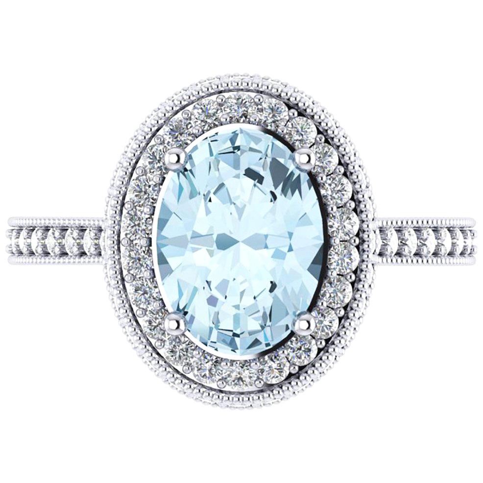 1.40 carat natural oval Aquamarine adorned by a double halo of round bright diamonds for a total carat weight of 0.51 carats, conceived in a hand made 18k white gold ring.

Handcrafted with the best Italian manufacturing quality, a classic beauty,