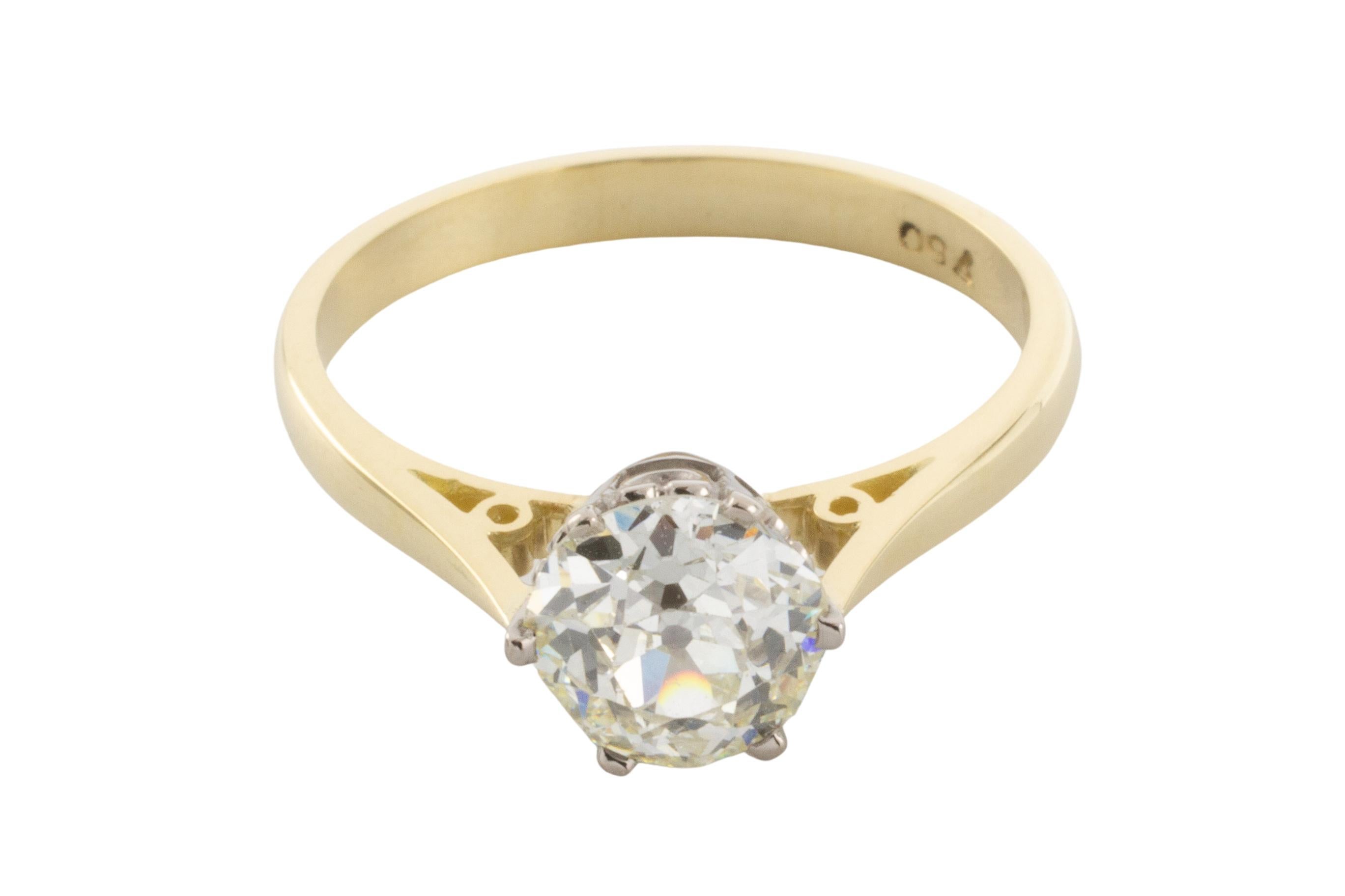 A stunning 18 karat white and yellow gold solitaire ring set with an old mine cut diamond. 

The diamond is 1.40 carat in total, VS in quality and K in color. 
This classic old mine cut has 58 facets, a culet facet to the base of the stone and