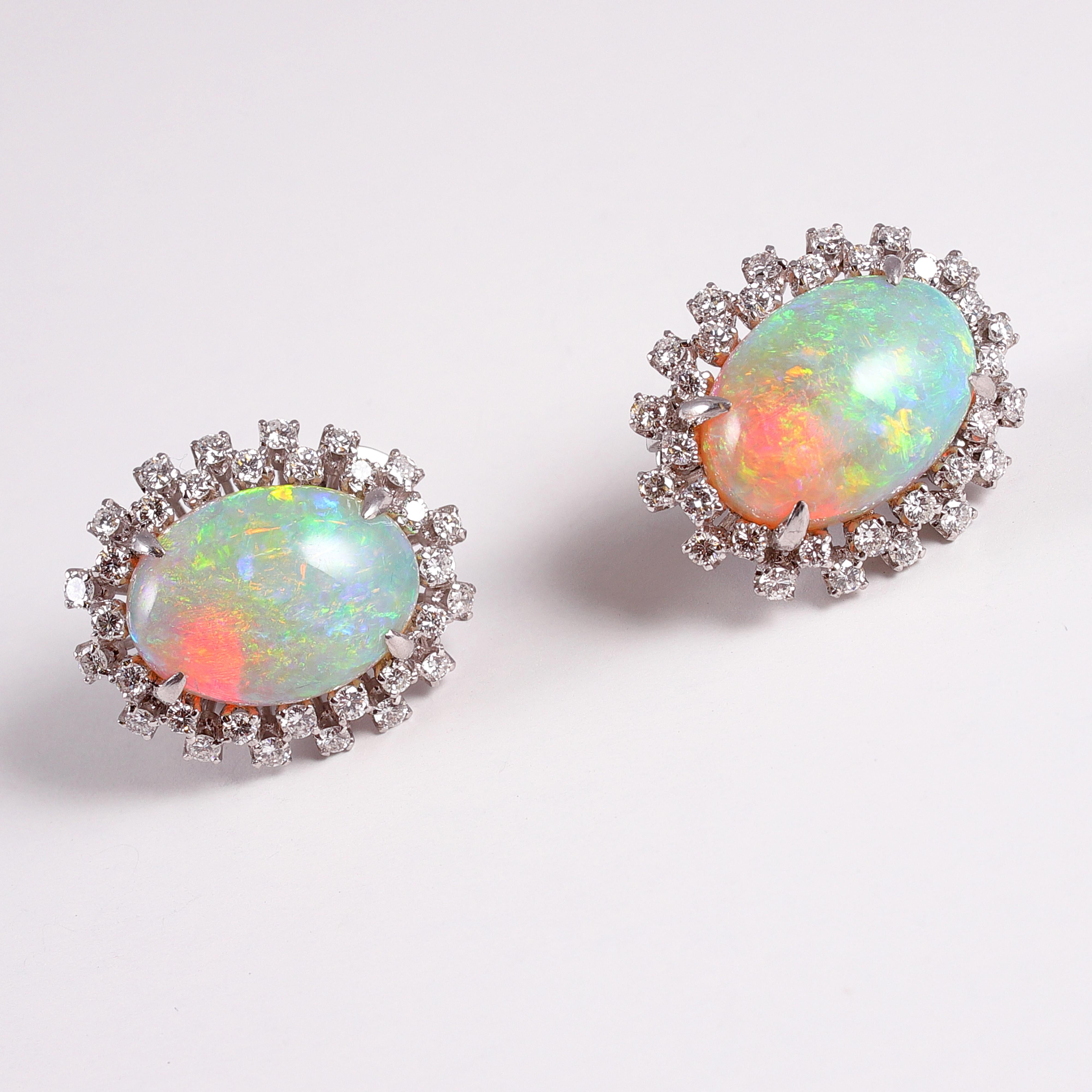 These clip on beauties are set in 14 karat white gold and support a total of 14.00 carats of opals and 0.75 carats of diamonds!