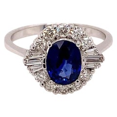 1.40 Carat Oval cut Blue Sapphire and Diamond Cluster Ring in 18K White Gold