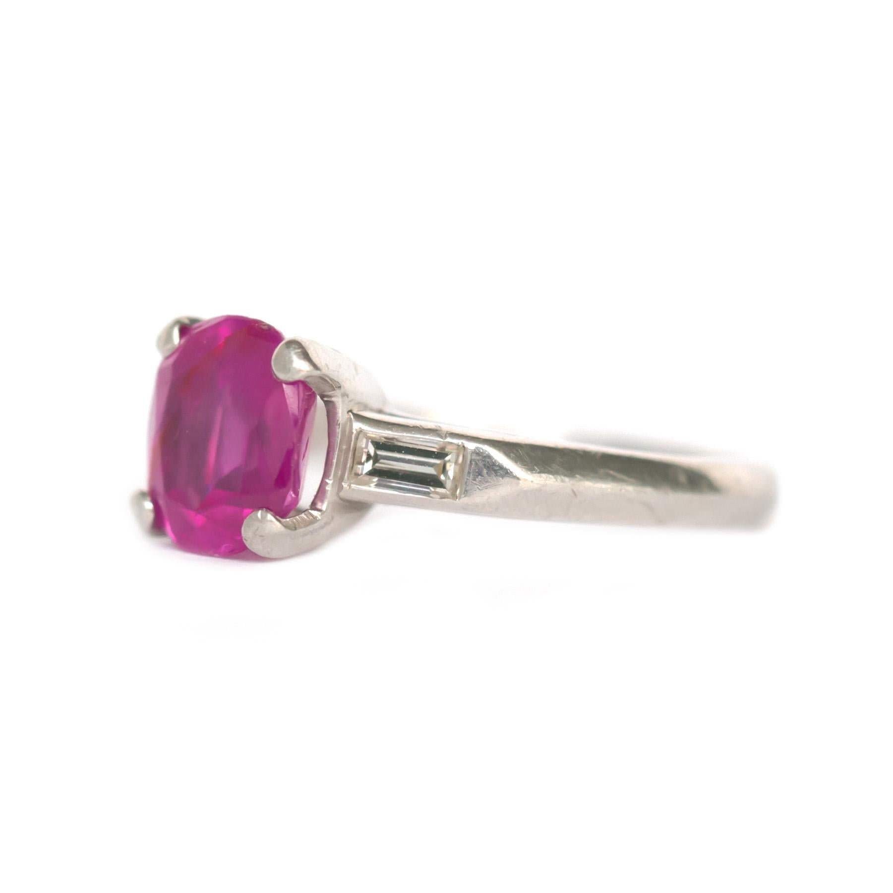 Ring Size: 4.5
Metal Type: Platinum [Hallmarked, and Tested]
Weight: 3.8  grams

Center Sapphire Details:
Weight: 1.40 carat
Cut: Old Cushion 
Color: Intense Pink
Clarity: SI
Treatment: Unheated

Side Diamond Details:
Weight: .15 carat, total