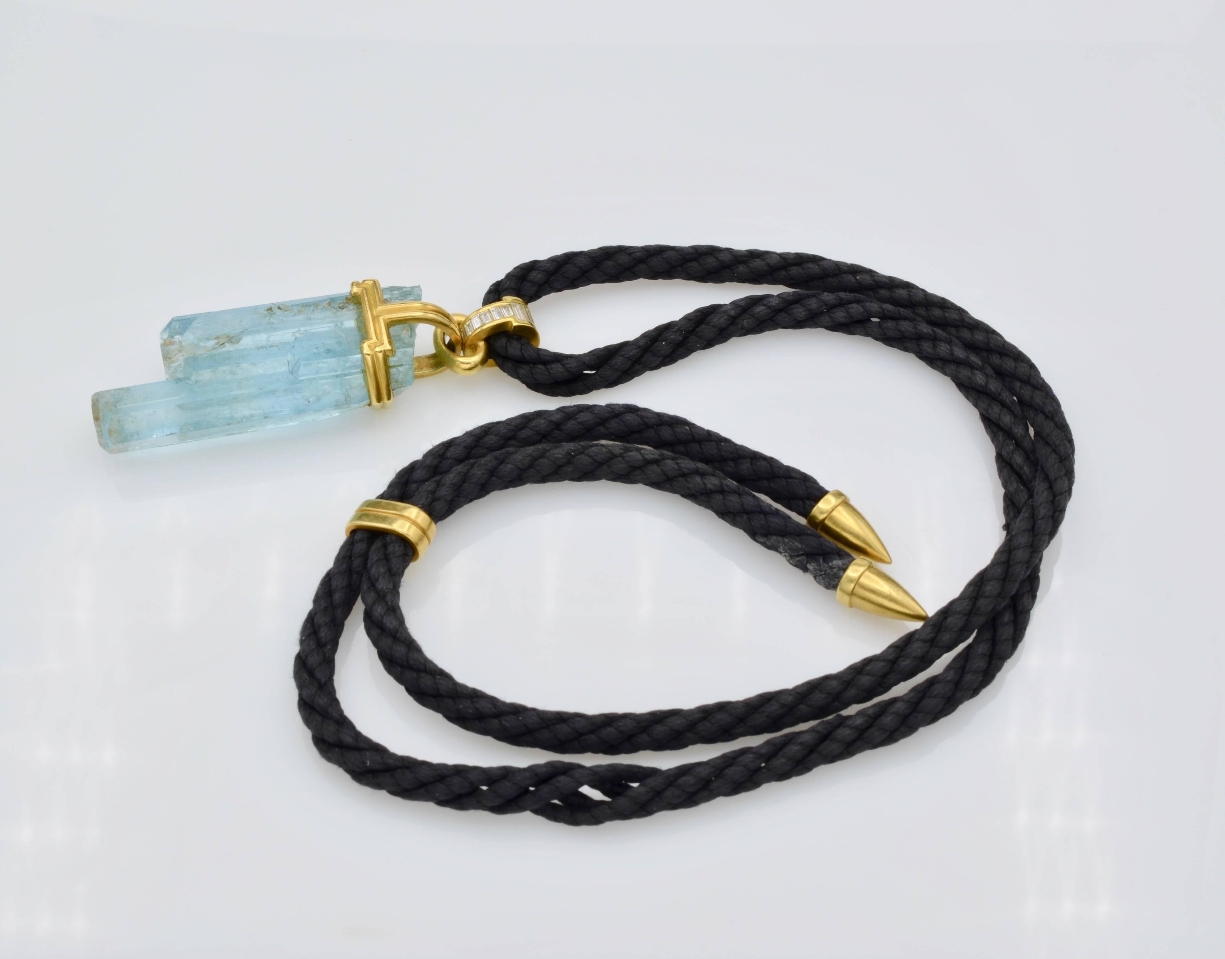 This gorgeous bright blue 1990's vintage organic aquamarine pendant necklace has over 1 carat of baguette diamonds in gold to sparkle and shine adding complimentary and contrasting style. Very modern and chic, a statment necklace to add a pop of