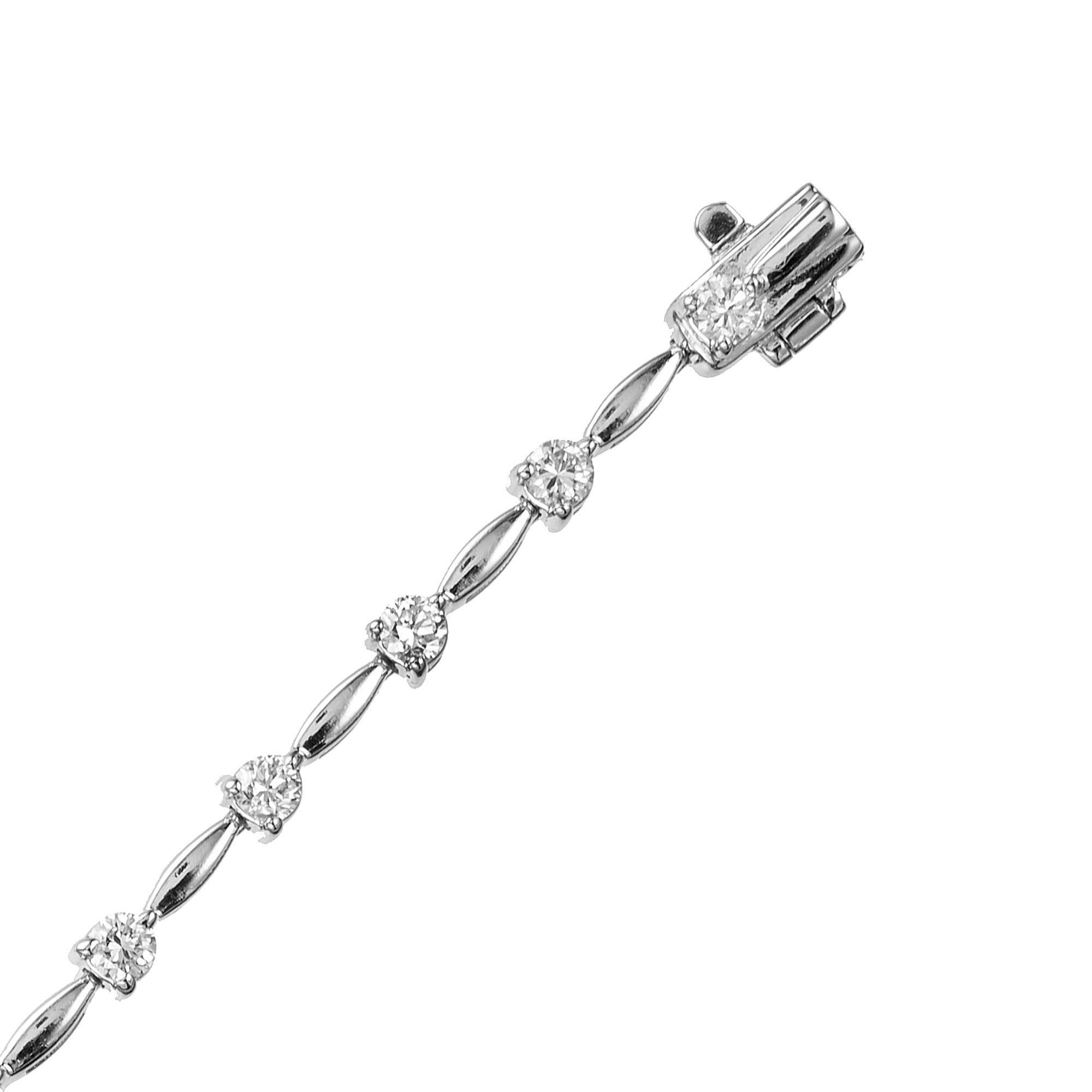 This diamond link tennis bracelet is adorned with 20 round brilliant cut diamonds totaling 1.40cts. Each diamond is separated by 14k white gold marquise style spacers. The bracelet measures at 6.75 inches and the clasp is secure with an under catch.