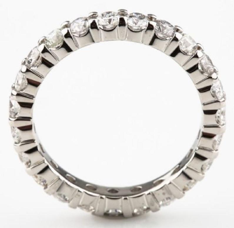 Beautiful Platinum Eternity Band Ring
Size 4.75 (Not Sizable)
Includes 23 Round Brilliant Round Cut Diamonds
Total Diamond Weight = 1.40 Carats
Average Color = F - G
Average Clarity = VS - SI
Total Mass = 3.6 g