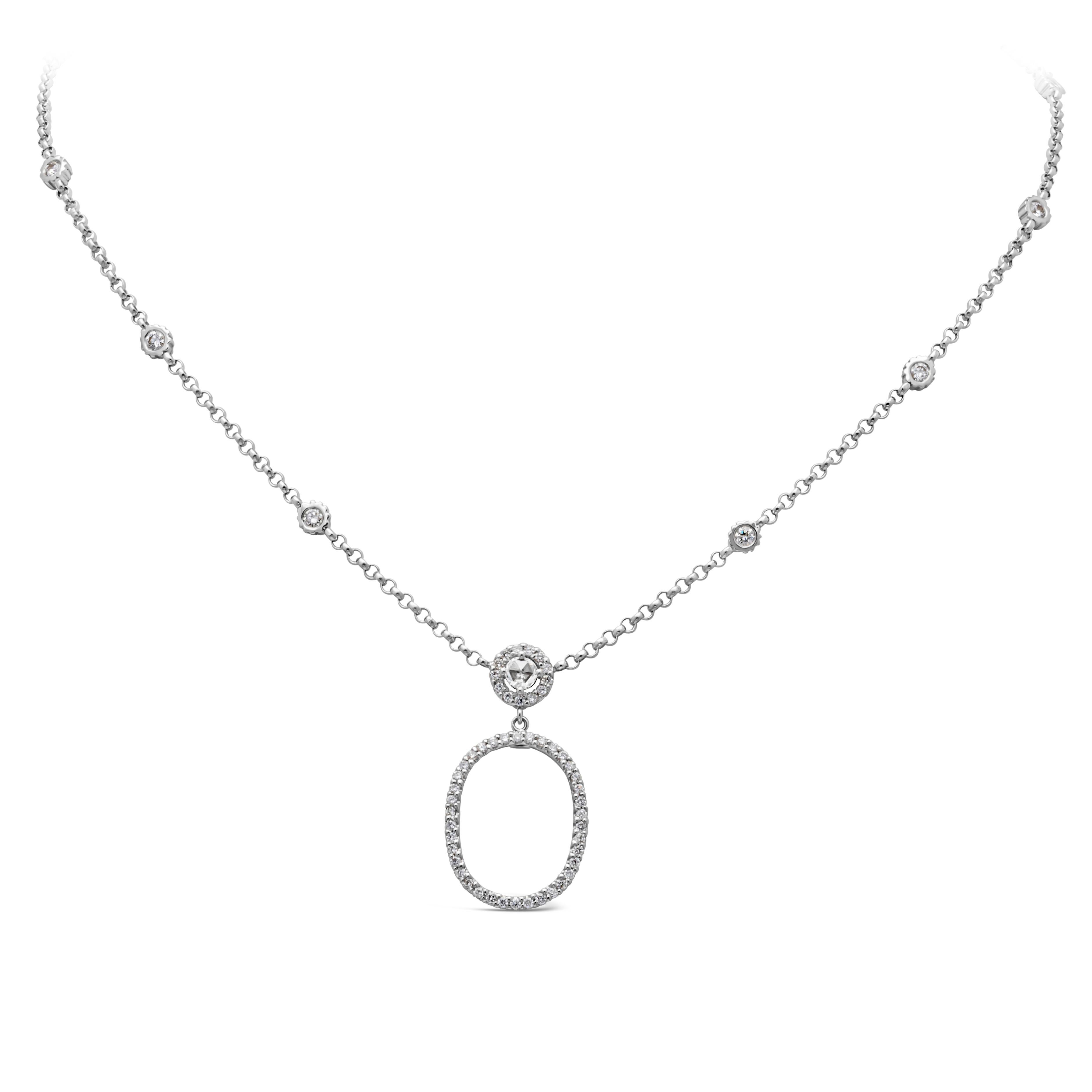 Well crafted pendant necklace showcasing an 18K white gold oval open work design clustered with brilliant round diamonds suspended on an elegant diamond by the yard chain. 60 pieces in total, diamonds weighs 1.40 carat total, G color and VS in