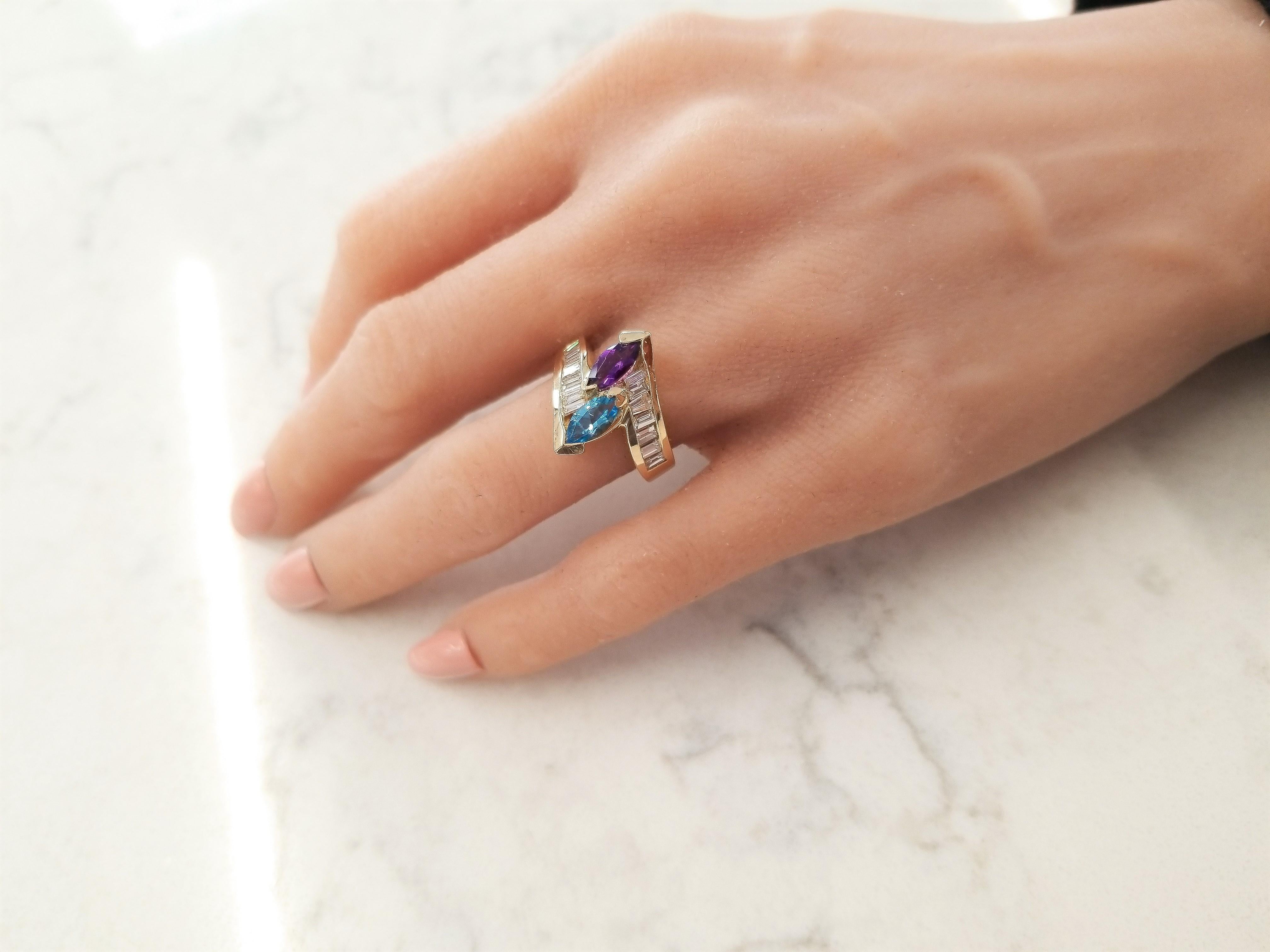 Best friends forever, amethyst and blue topaz are a magnificent pair. These marquise gemstones are set into a bypass ring design and are accompanied by gorgeous baguette diamonds. The diamonds are securely channel set into the striking 14 Karat
