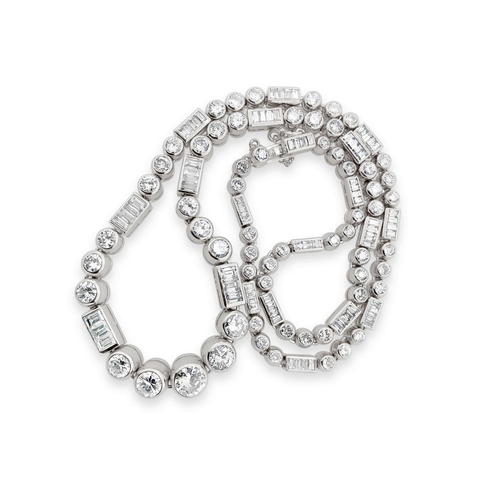 14.0 Carat (total weight) Round and Baguette Diamond Necklace set in Platinum, with a Platinum Barrel Clasp and Safety Chain. Length is 16
