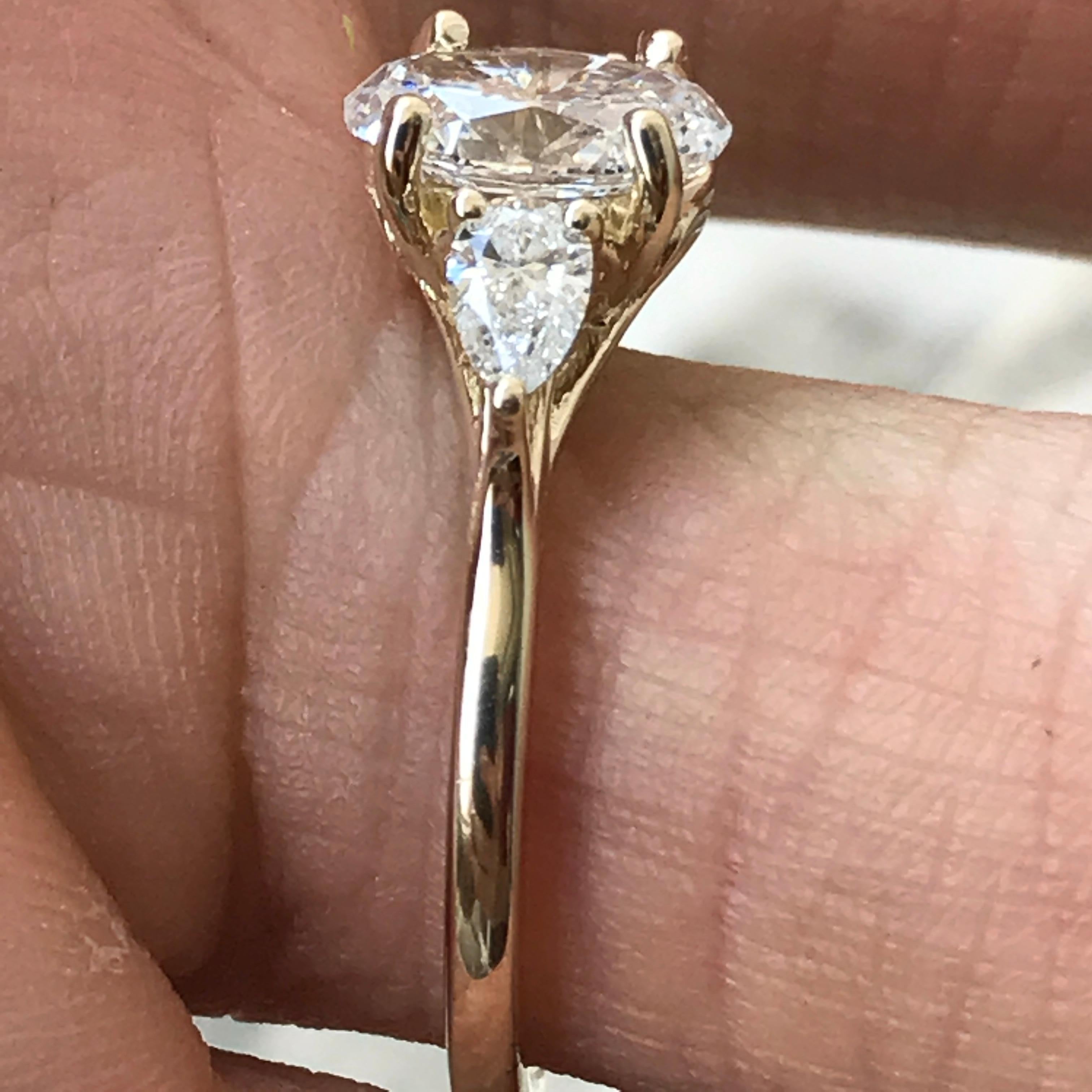 1.5 carat three stone diamond ring