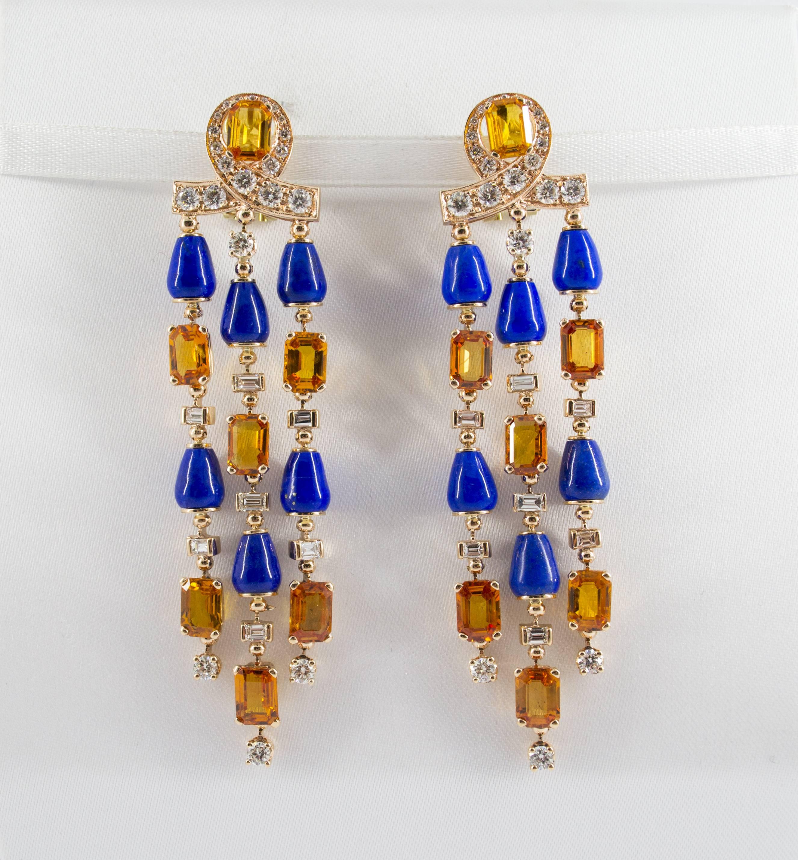 These Earrings are made of 14K Yellow Gold.
These Earrings have 2.90 Carats of White Diamonds.
These Earrings have 14.00 Carats of Yellow Sapphires.
These Earrings have also Lapis Lazuli.
All our Earrings have pins for pierced ears but we can change