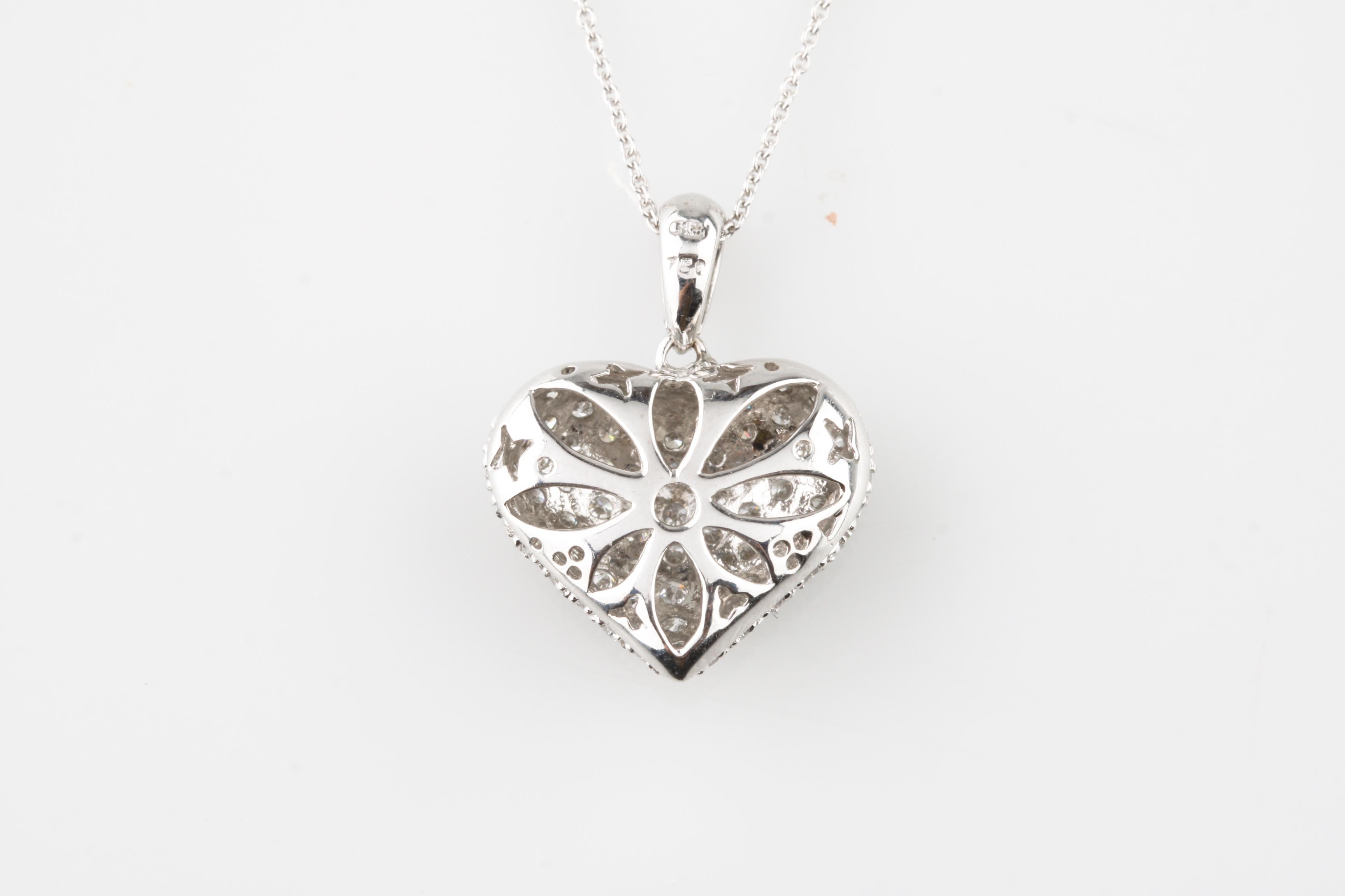Gorgeous 18k White Gold Pavé Diamond Heart Pendant
Features 106 Round Cut Diamonds in Pavé Settings
Total Diamond Weight = Approximately 1.4 ct
Average Color = G - H
Average Clarity = VS
Width of Pendant = 18 mm
Length of Pendant (Including Bail) =