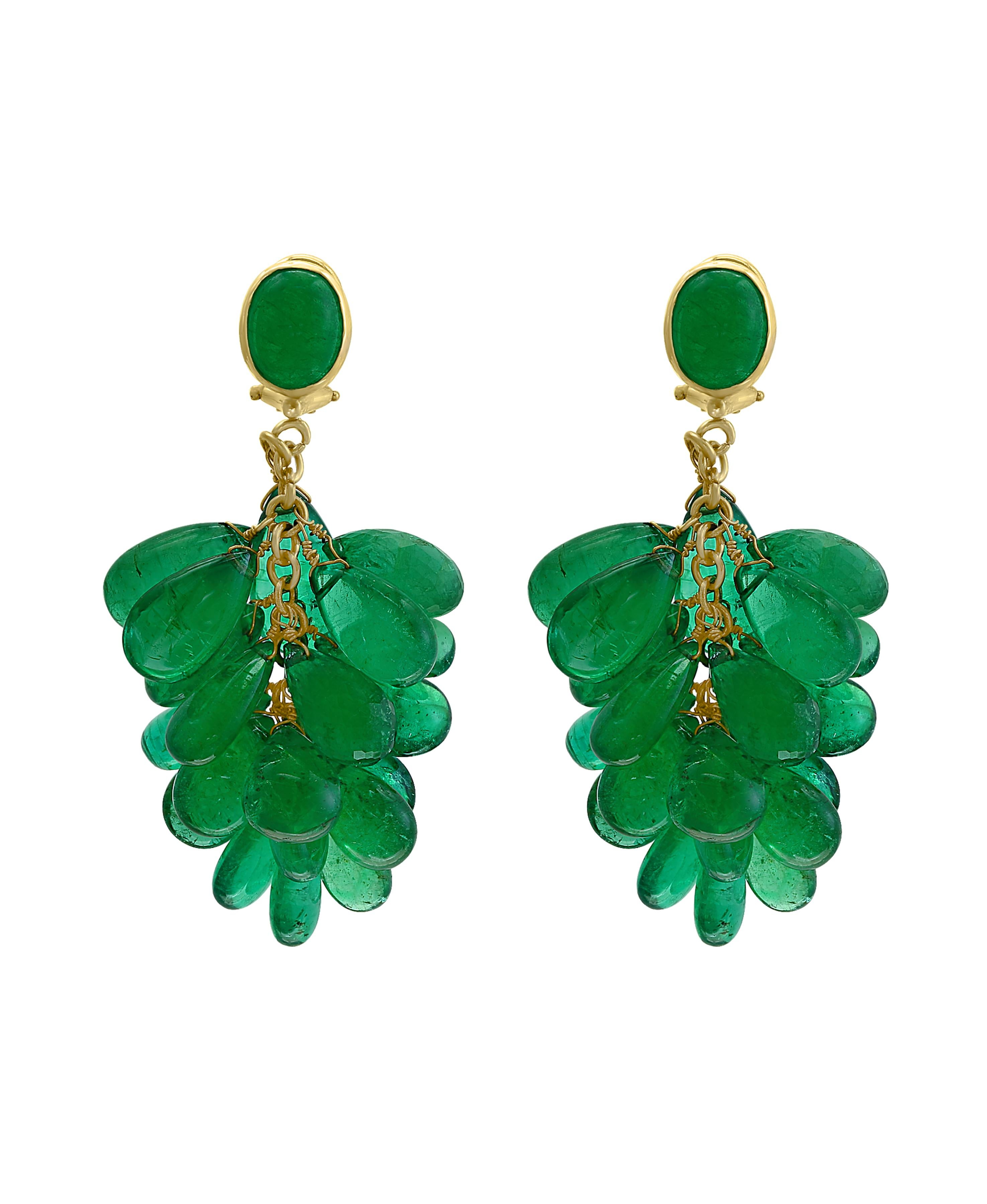 140 Carats Emerald Briolettes   Hanging Earrings  18 Karat Gold.
This exquisite pair of earrings are beautifully crafted with 18 karat yellow gold  weighing 16.5 grams
This pair of Earrings has two fine  Cabochon Emerald  weighing approximately 16
