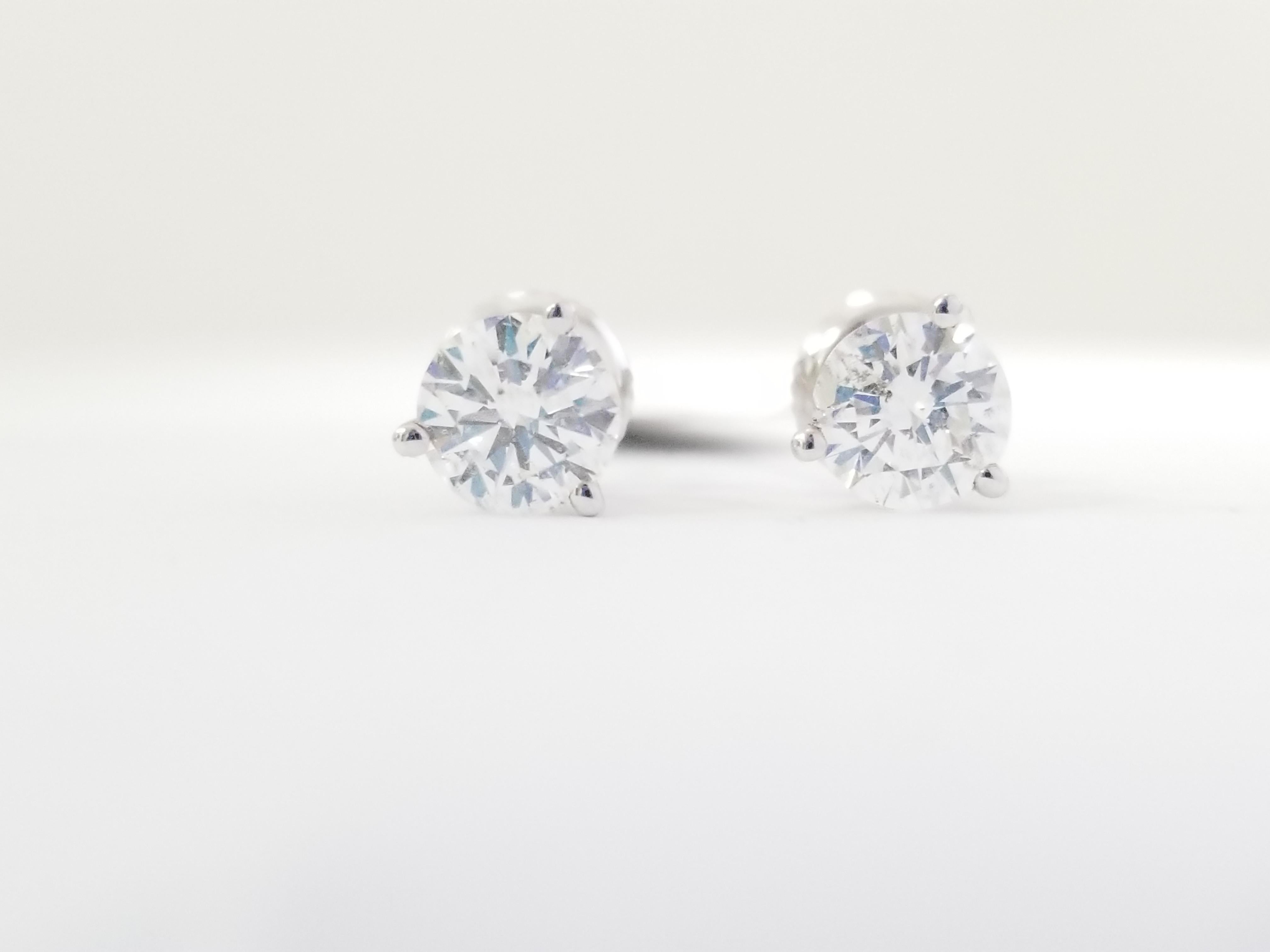 Natural Round Diamond Studs set in 3 prong martini setting with screw back 14k white gold 1.40 carats total weight. White face up, Clean. Average Color H-I, Clarity VS-SI.