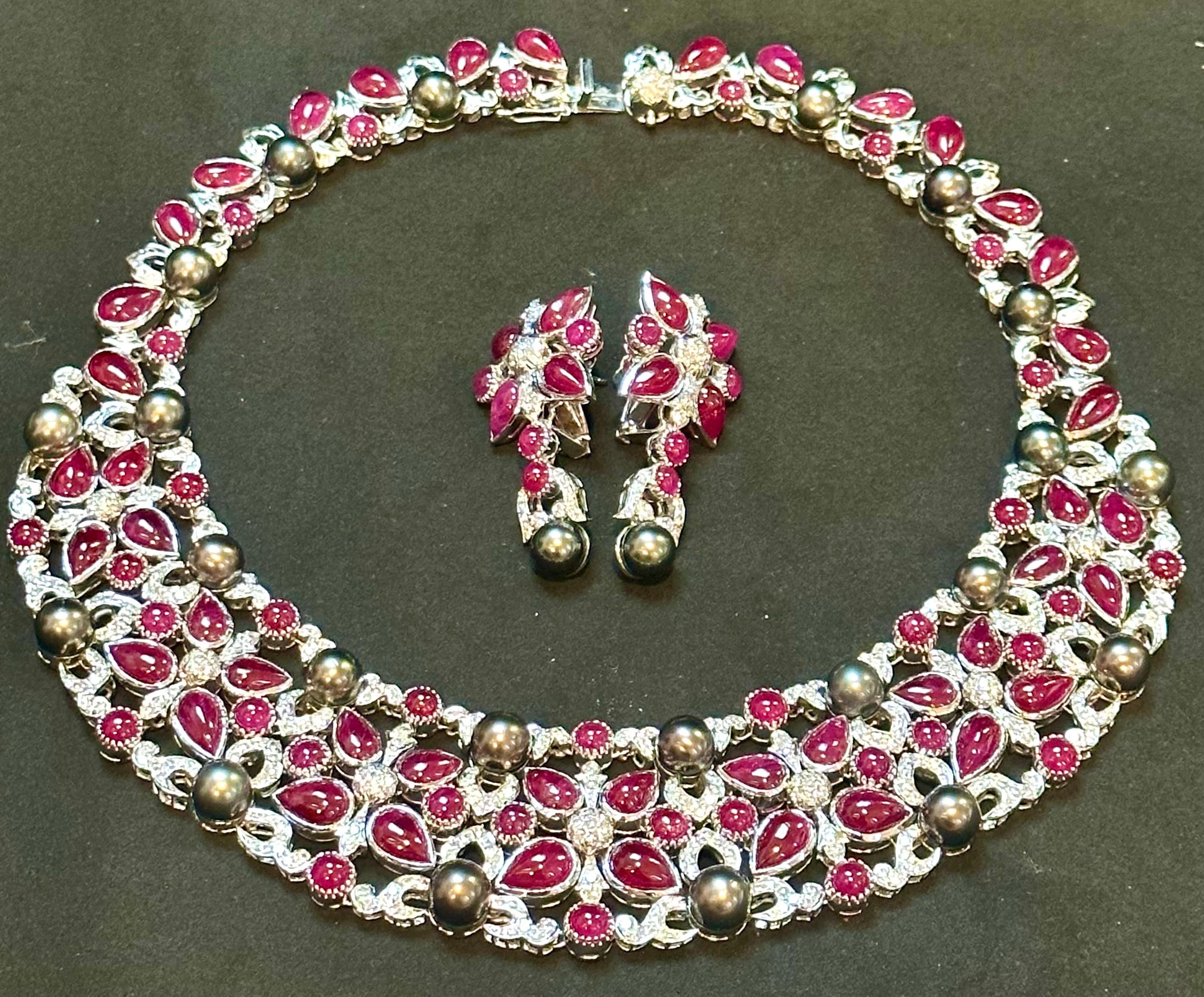 Presenting GIA Certified an opulent blend of vintage charm and luxury, this collar necklace is truly exceptional. It boasts an array of 52 pear-shaped natural Burma ruby cabochons, 50 round Burma ruby cabochons, totaling captivating 140-carat Burma
