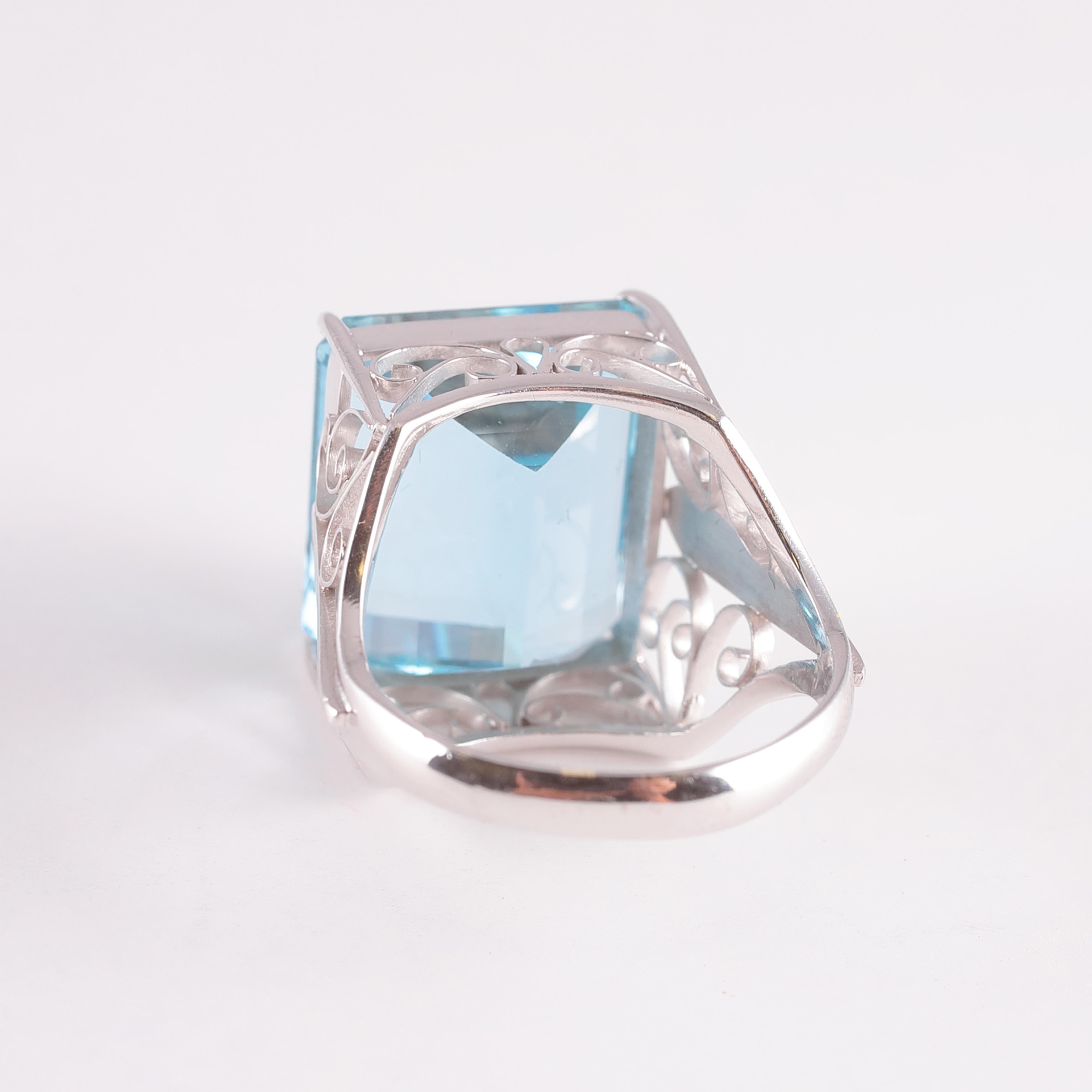 The blue color of this aquamarine is simply lovely! Purchased from A. B. Levy out of a Florida estate, this 14.00 carat stunner is in 18 karat white gold. The mounting is as lovely as the stone! Size 5 1/2.
