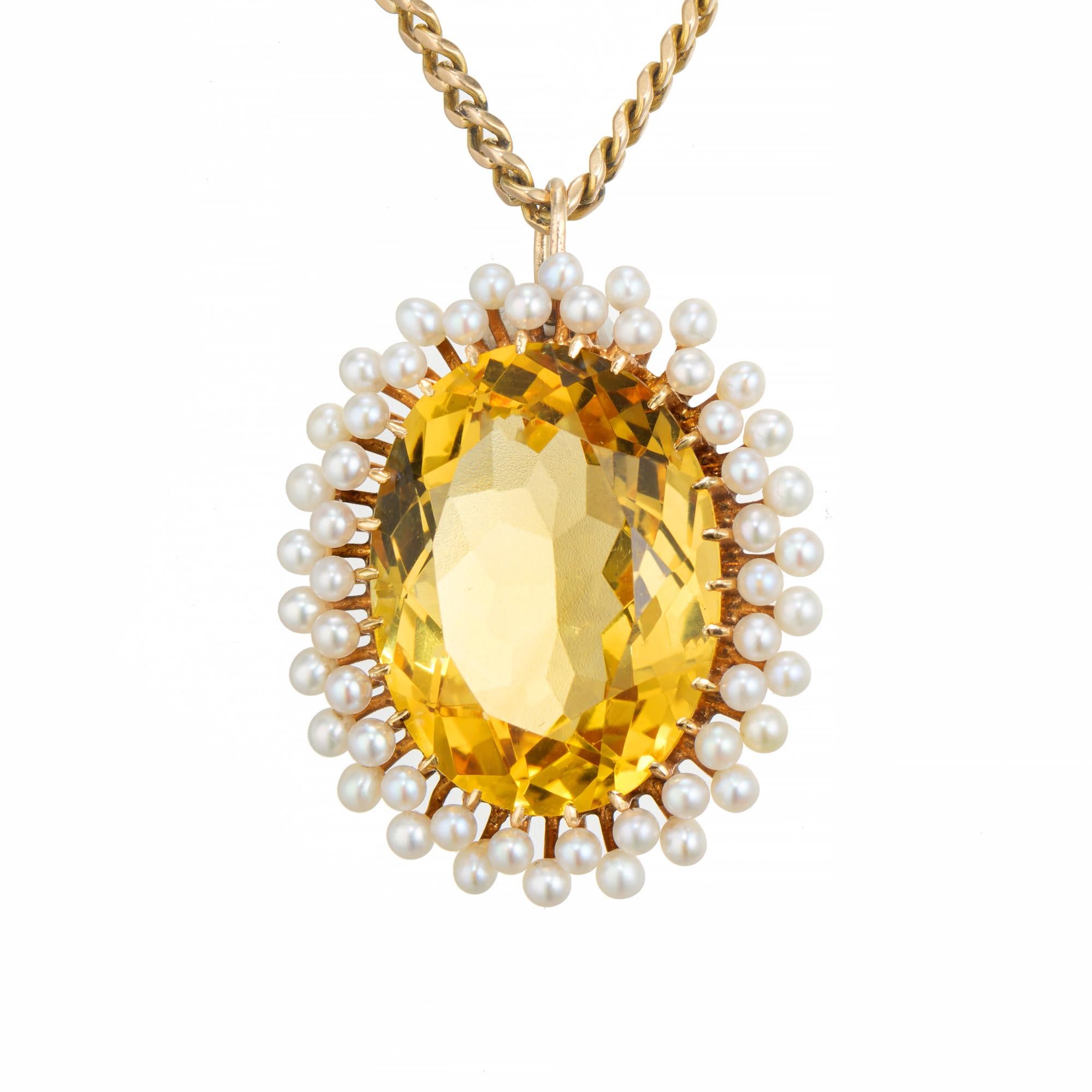 1900's large citrine and pearl pendant necklace. Beautiful 14.00ct oval citrine set in a 14k yellow gold setting with a halo of 52 white/crème cultured pearls. This turn of the century, spectacular natural golden yellow oval  citrine is accented