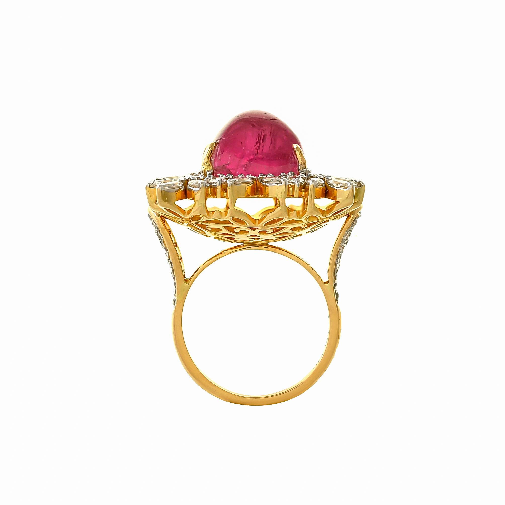 One-of-a-kind treasures from our limited edition collection handcrafted in 18kts yellow gold featuring gorgeous rubellite cabochon weighing approximately 14.00 carats with a diamond surround further accented by marquis cut diamonds with a total