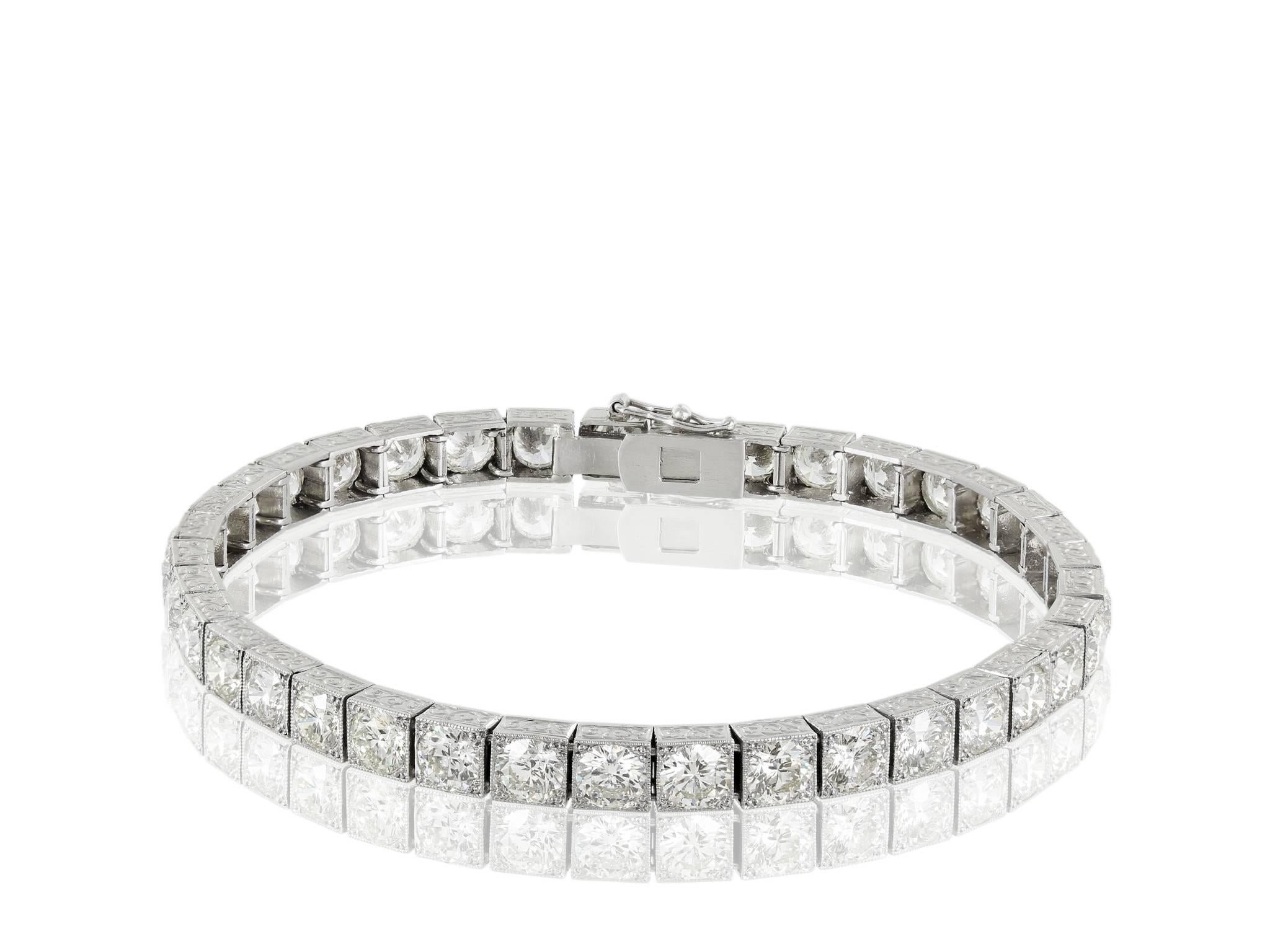 Platinum vintage style engraved block bracelet consisting of 37 round brilliant cut diamonds having a total weight of approximately 14.00 carats.
