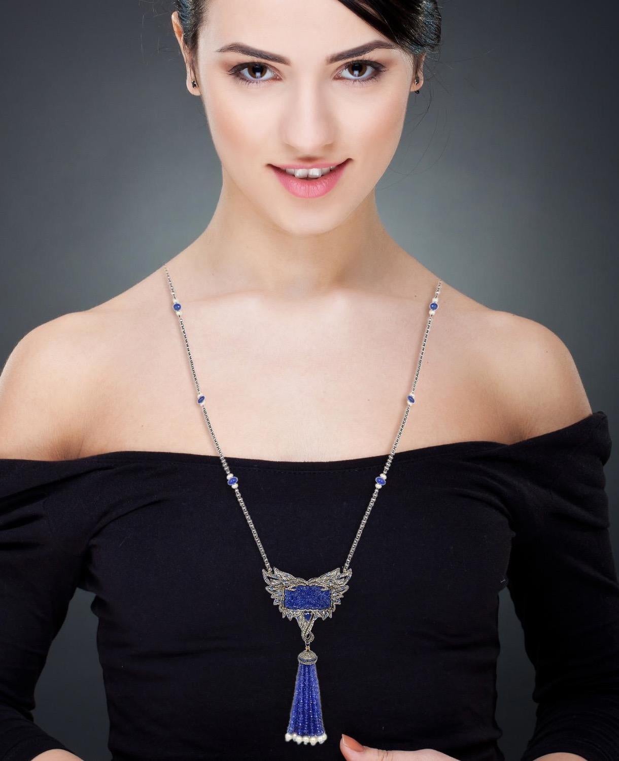 A stunning tassel necklace is handmade in 18K gold and sterling silver. It is set in 140.29 carats tanzanite, 2.11 carats sapphire & 3.26 carats of glimmering diamonds. Clasp Closure

FOLLOW  MEGHNA JEWELS storefront to view the latest collection &