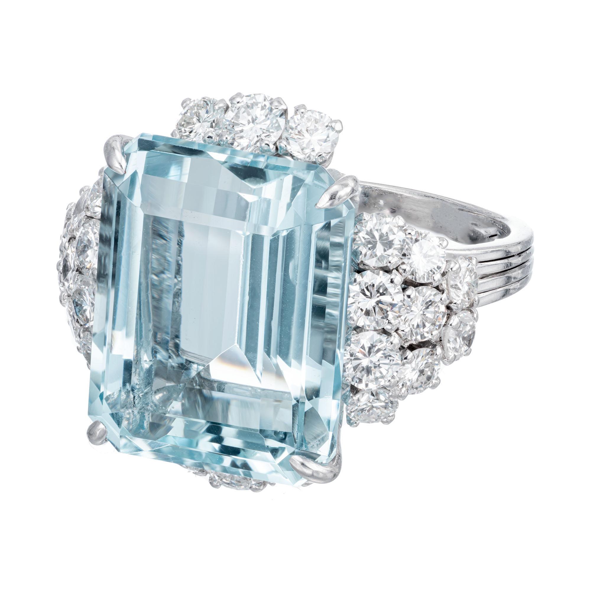 Natural top gem aqua 14.04 Carat emerald cut in a totally hand made French ring with extra sparkly high-quality diamonds. Circa 1950.

1 rectangular step cut greenish blue aquamarine VS, approx. 14.04cts
24 round brilliant cut diamonds F-G VS 
Size