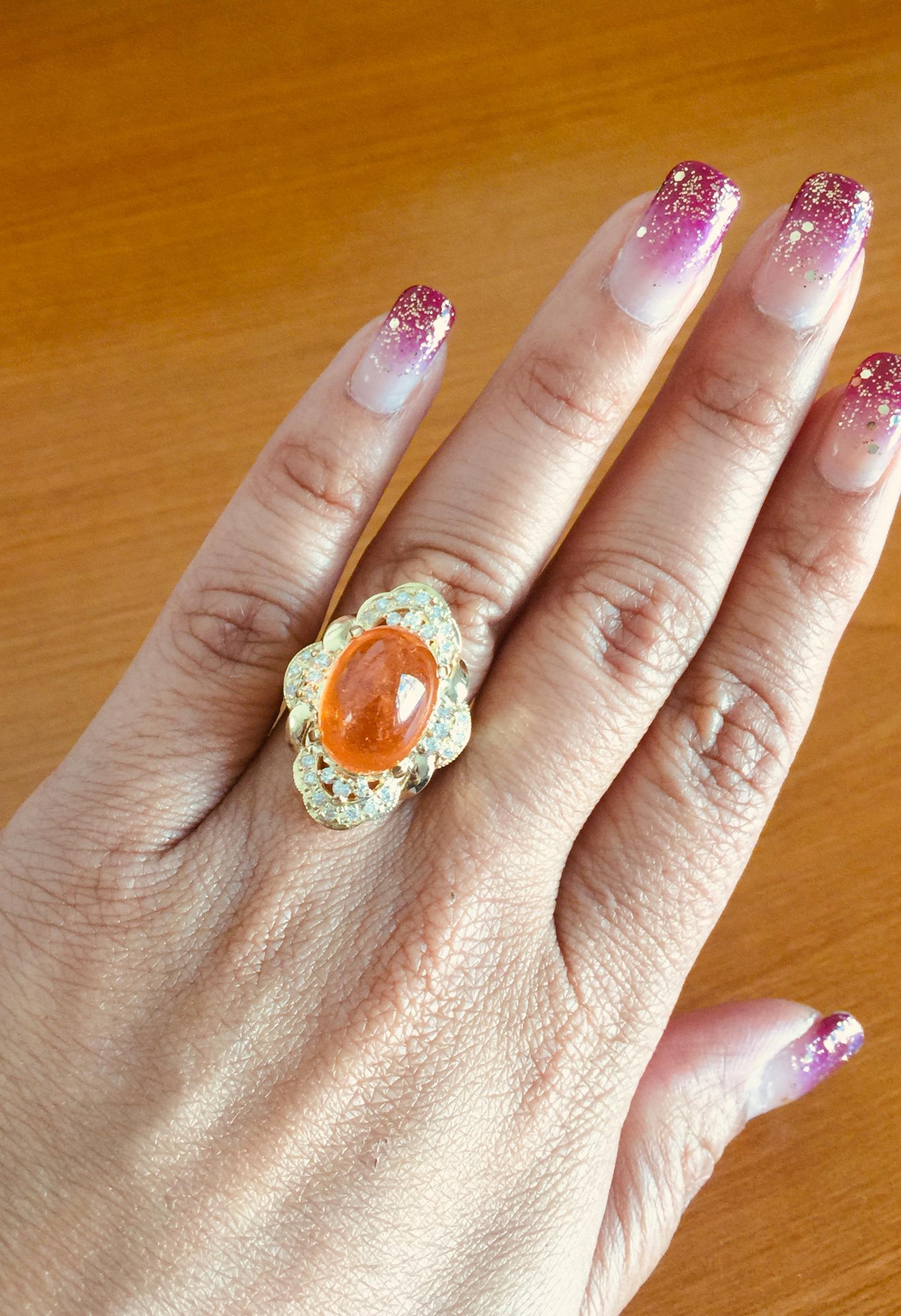 Oval Cut 14.05 Carat Spessartine Garnet Diamond Yellow Gold Cocktail Ring For Sale
