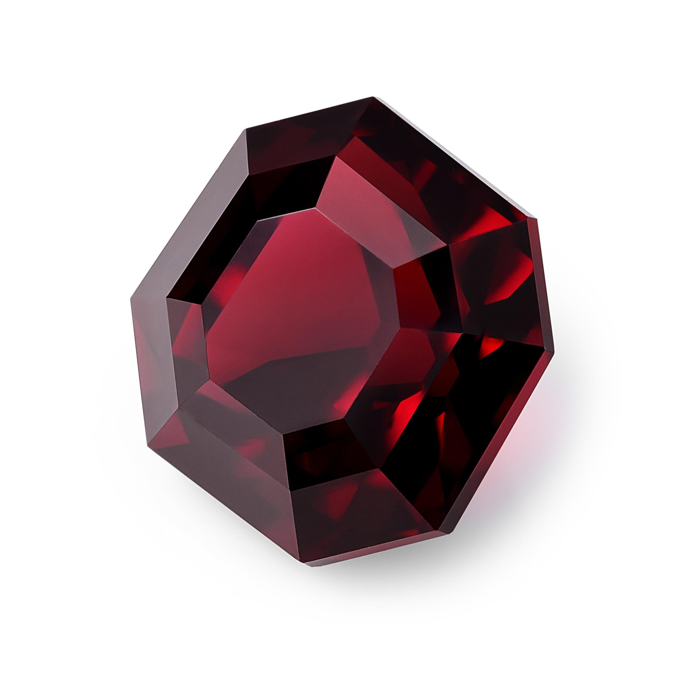 Weighing an impressive 14.05 carats, this natural garnet is a striking gemstone with an octagon shape, featuring eight sides and cut corners. Measuring 13.14 x 13.38 x 9.52 mm, it presents a substantial and visually appealing presence. The