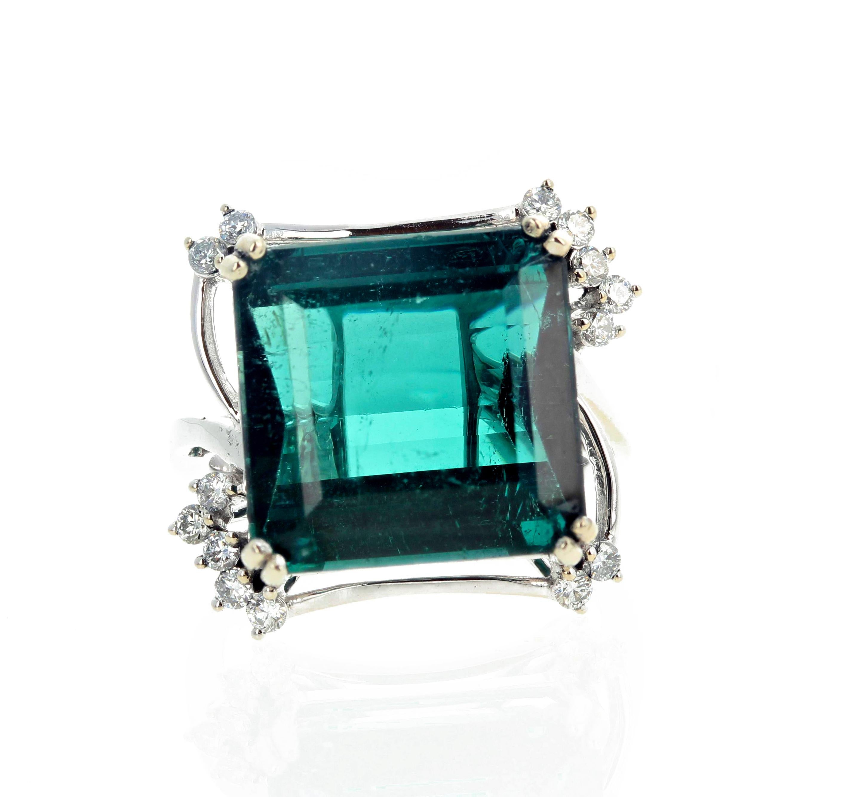 Gorgeous green-blue Natural Tourmaline (14. 7 mm x 14.4 mm) set in a white gold ring enhanced with .31 carats of sparkling white diamonds.  This Tourmaline and Diamond ring is size 7 (sizable). 