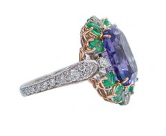 14.07 Ct Tanzanite, Emeralds, Diamonds, 14 Karat White Gold and Rose Gold Ring.