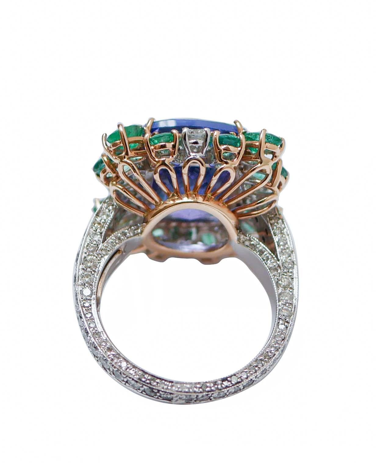 Retro 14.07 Ct Tanzanite, Emeralds, Diamonds, 14 Karat White Gold and Rose Gold Ring. For Sale