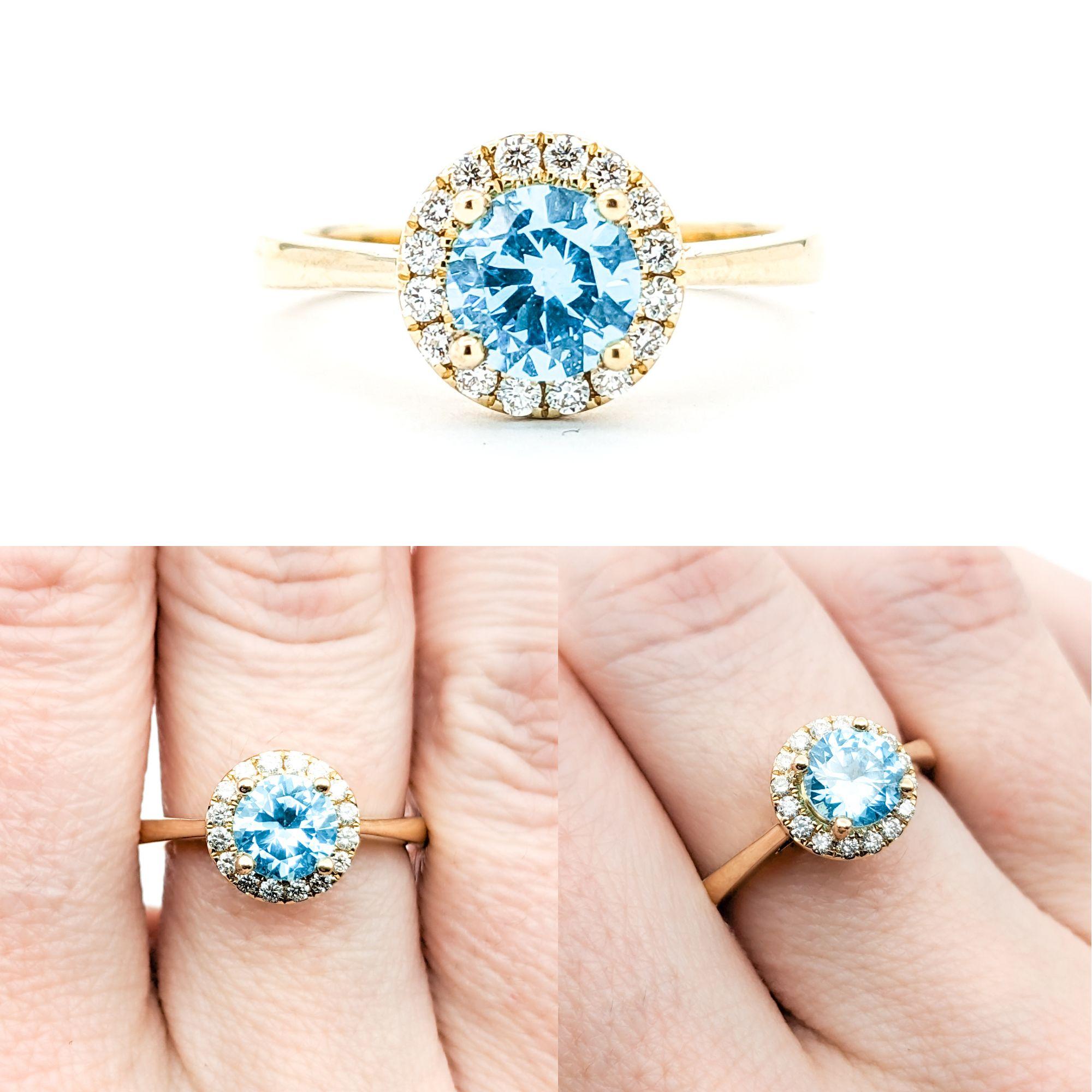1.40ct Blue Zircon & Diamond Ring In Yellow Gold

Introducing this elegant Ring crafted in 14kt white gold. It features a captivating 1.40ct Blue Zircon centerpiece complemented by .18ctw of Round Diamonds. The sparkling diamonds are of SI clarity