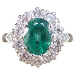1.40ct Emerald and 0.95ct Diamond Cluster Ring in Platinum with Diamond Shoulder