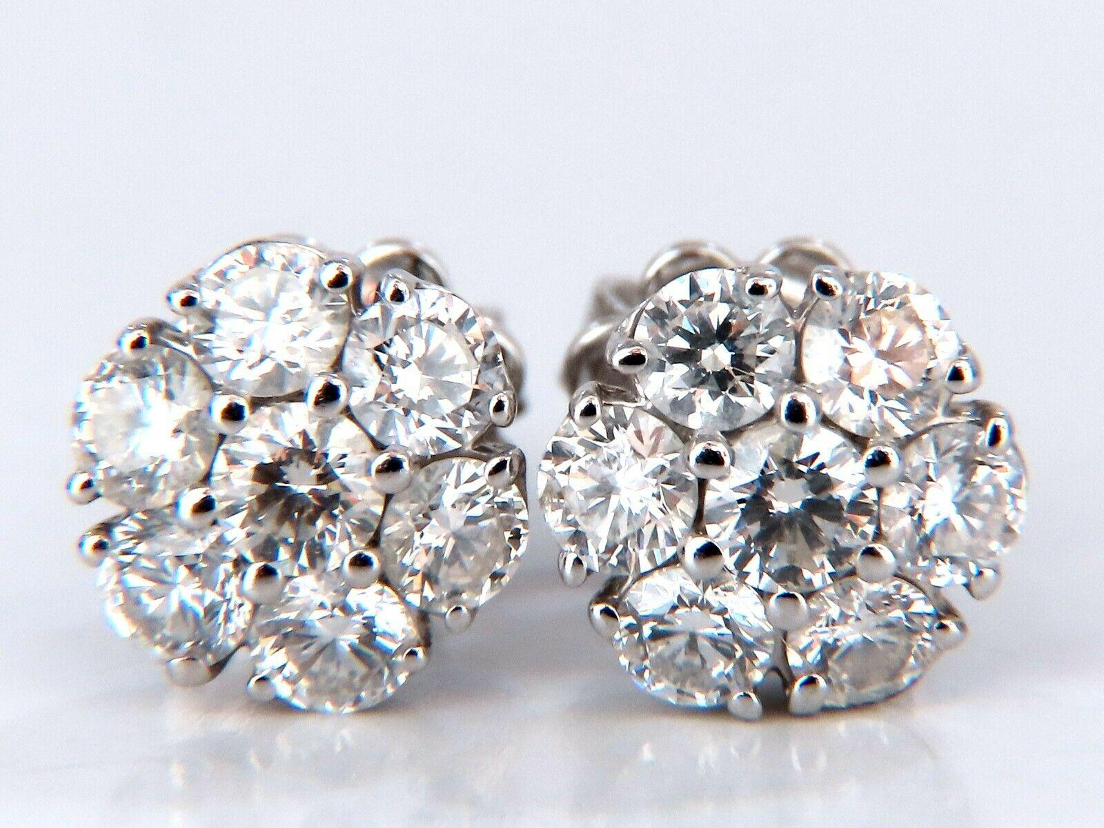 Floreta cluster snowflake diamond earrings.

1.40 carat natural round diamonds

G color vs2 clarity

14 karat white gold 2.6g

Earrings measure 8.7mm wide

$6,000 appraisal certificate to accompany