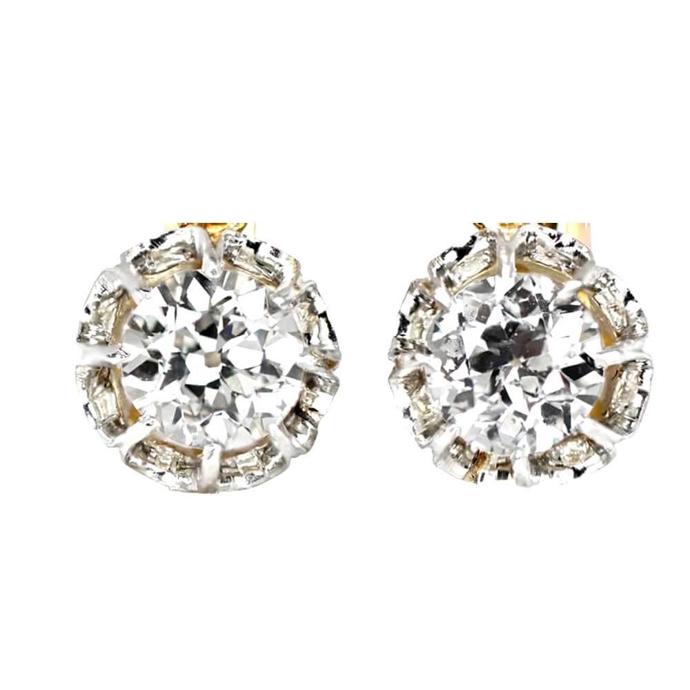 Dazzling and elegant, these diamond hanging earrings are designed to capture attention. Each earring showcases a beautiful old European cut diamond, weighing a total of 1.40 carats, and securely set in prongs. 

Adding an extra touch of