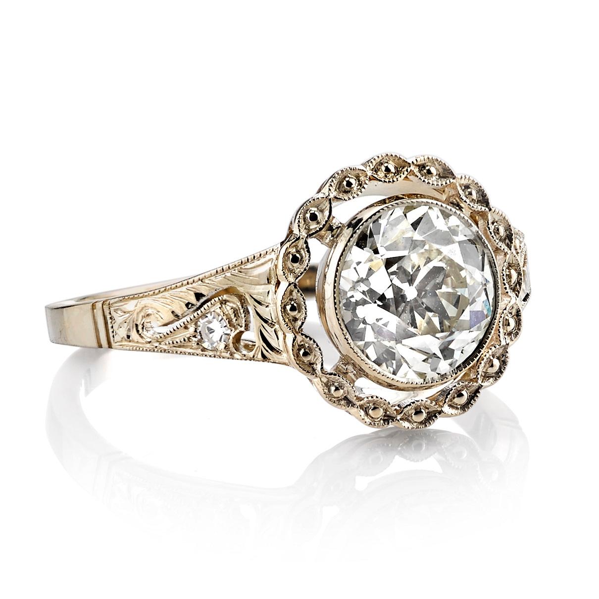 1.40ctw R-S/VS old Mine cut diamond with with 0.03ctw single cut accent stones set in an 18k champagne gold mounting. 

Ring is currently a size 6 and can be sized to fit.