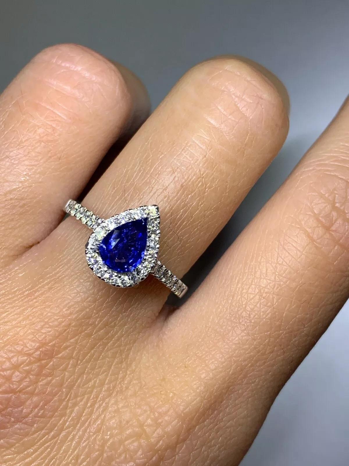 1.40ct Sapphire blue Ceylon pear shape diamond halo engagement ring 18ct gold.

Gorgeous blue sapphires pear shape with diamond halo engagement ring.

Sapphires Ceylon royal blue natural untreated total weight 1.00ct.

Diamonds total weight 0.40ct F
