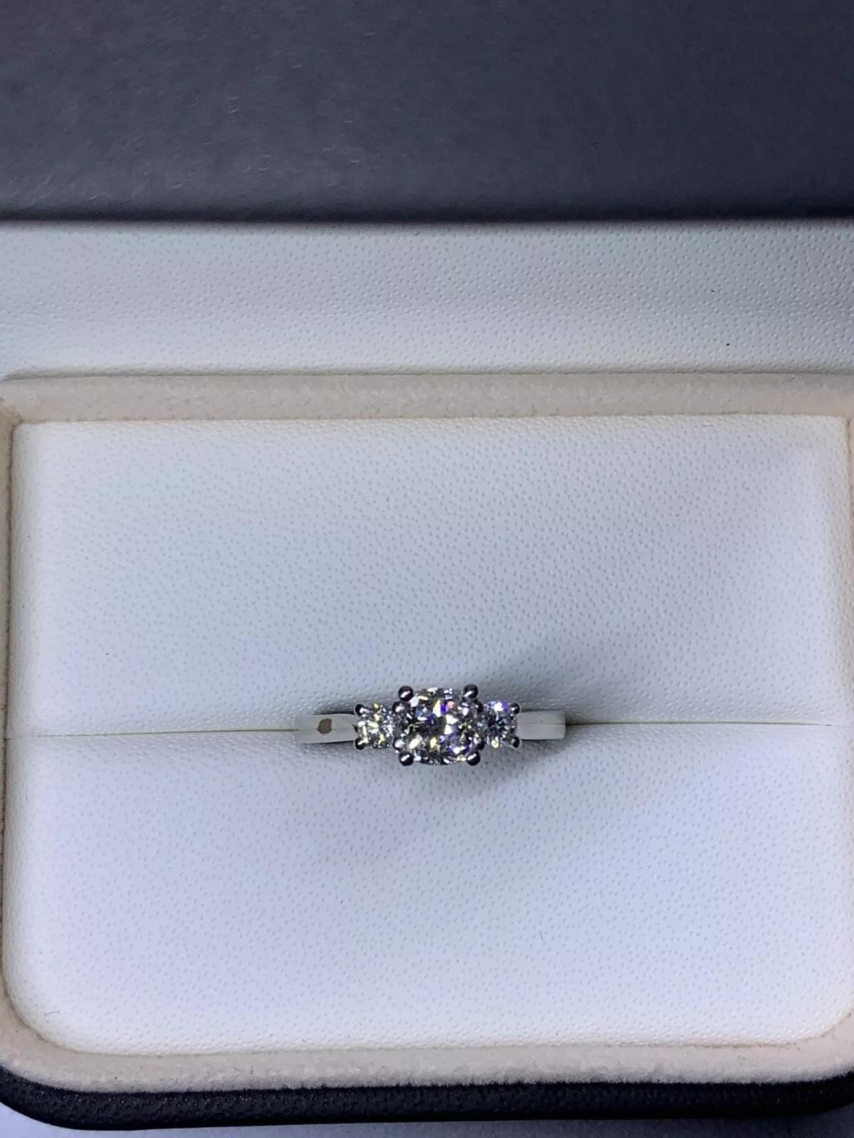 1.40ct Trilogy three diamonds cushion and round diamond engagement ring in platinum.

Trilogy engagement ring.

Natural GIA certified diamond three stone ring.

Classic cushion and two round diamond trilogy engagement ring in platinum.

Cushion