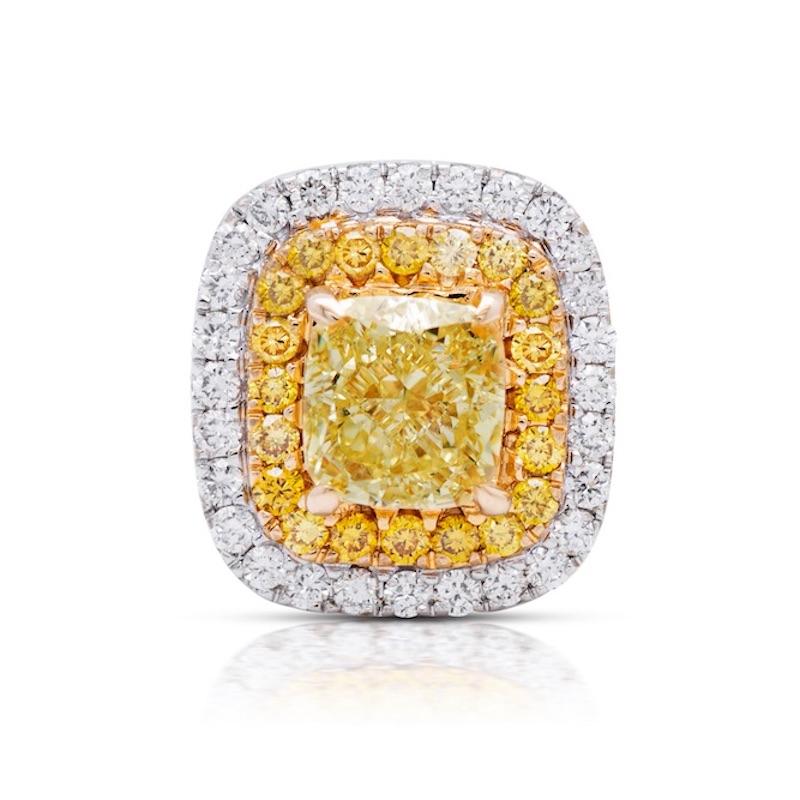 Fancy Yellow Cushion Studs
1.38 carat total diamond weight
VS Clarity 
Center diamonds are 0.50 ct each 
Surrounded by fancy yellow and white diamond
Handmade in NYC
Set in 18k Gold

Making Extraordinary Attainable with Rare Colors
